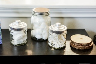 Cotton balls and q-tips in jars from the Dollar Tree.