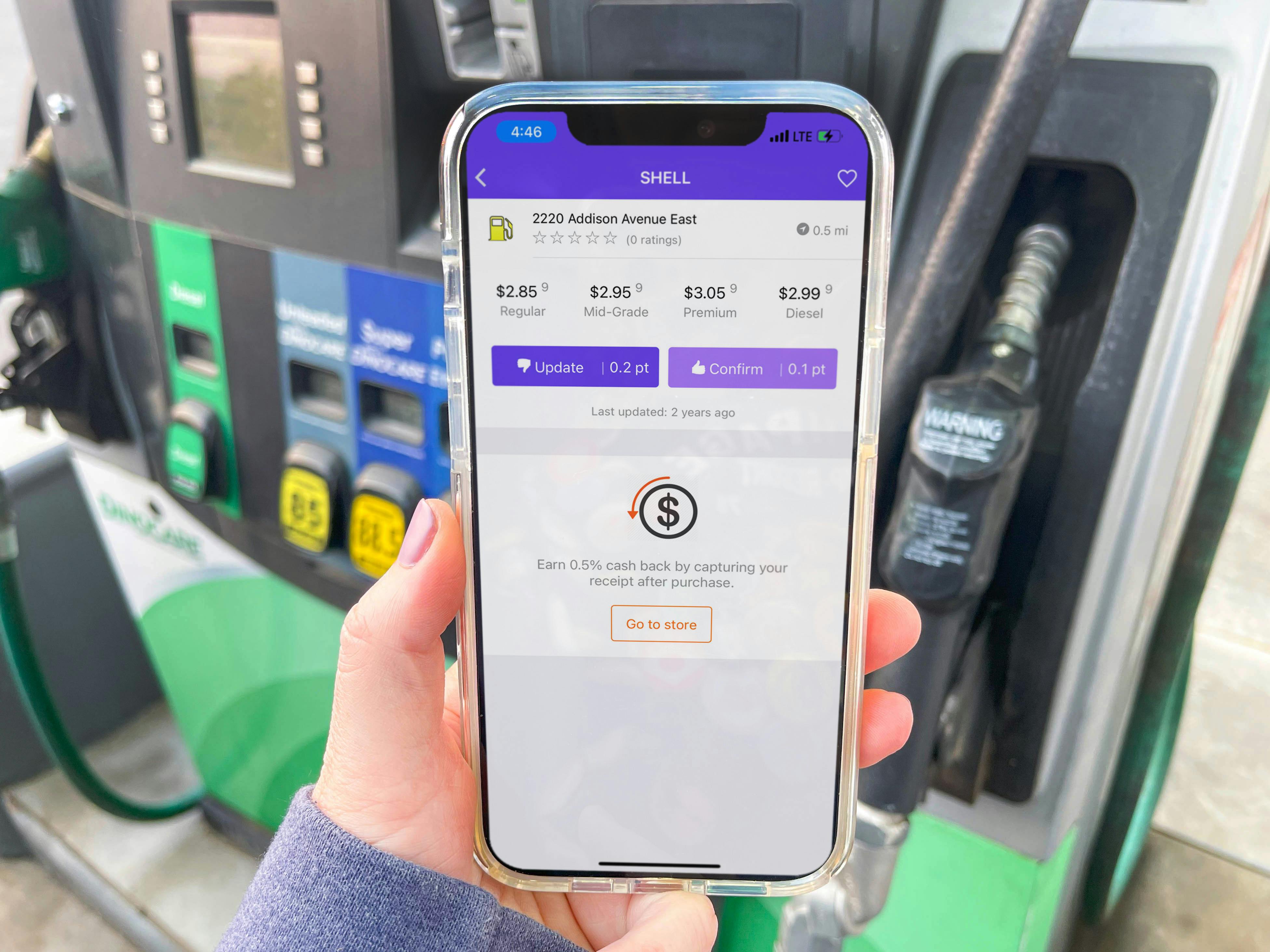 cellphone being held in front of gas pump with the TruNow app displayed