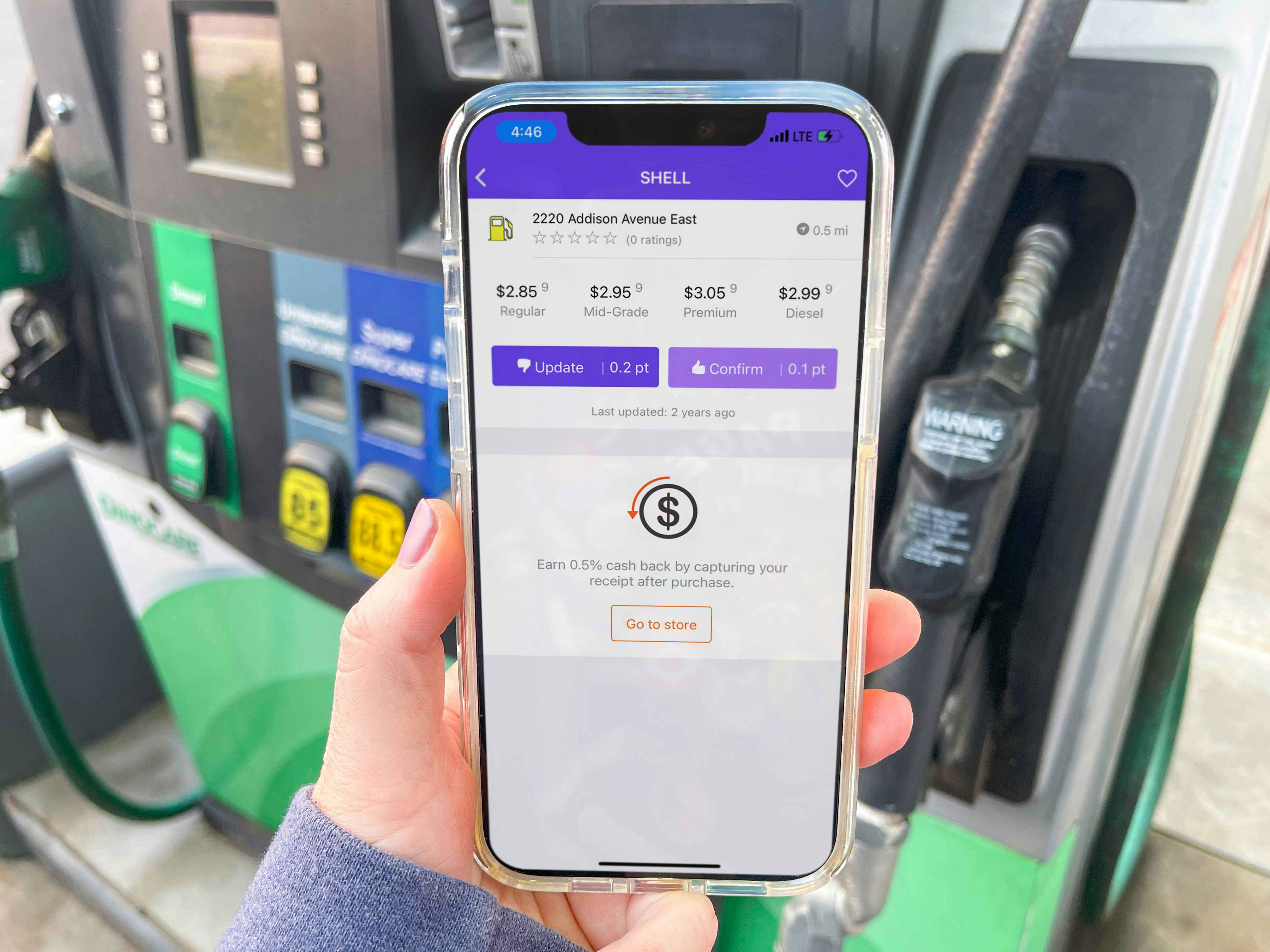 cellphone being held in front of gas pump with the TruNow app displayed