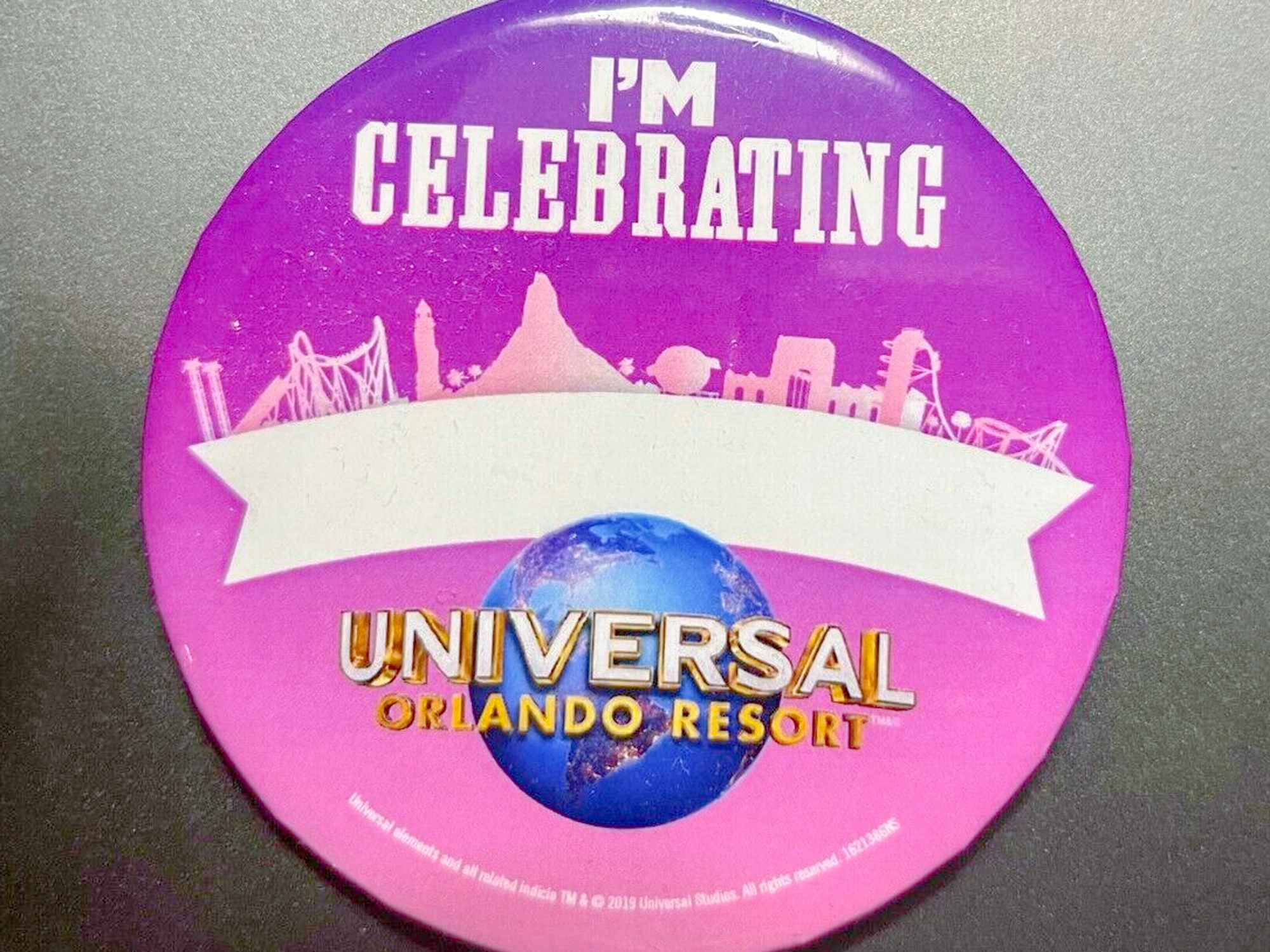 a celebration button from universal studios 