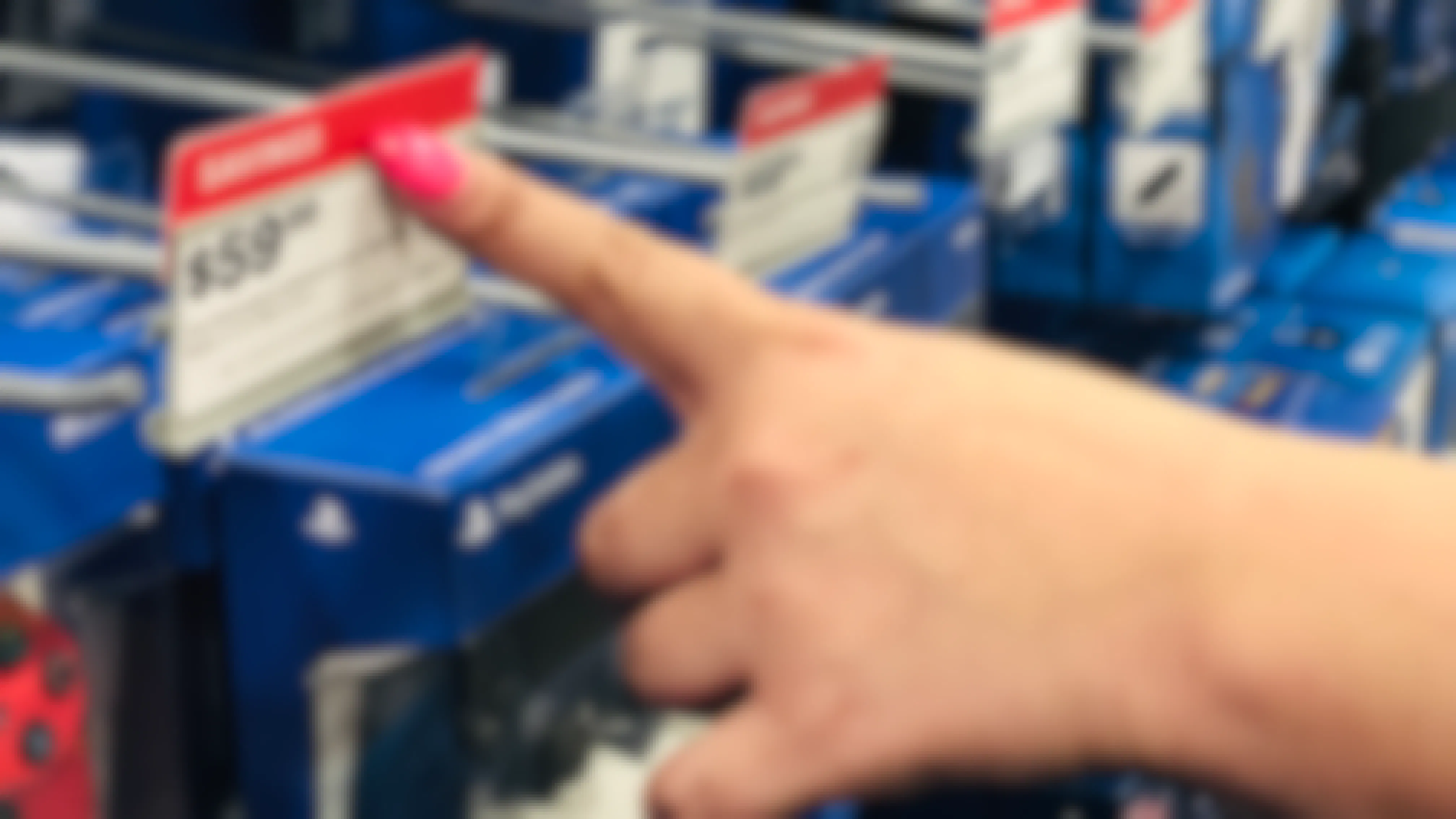 hand points to best buy red tag