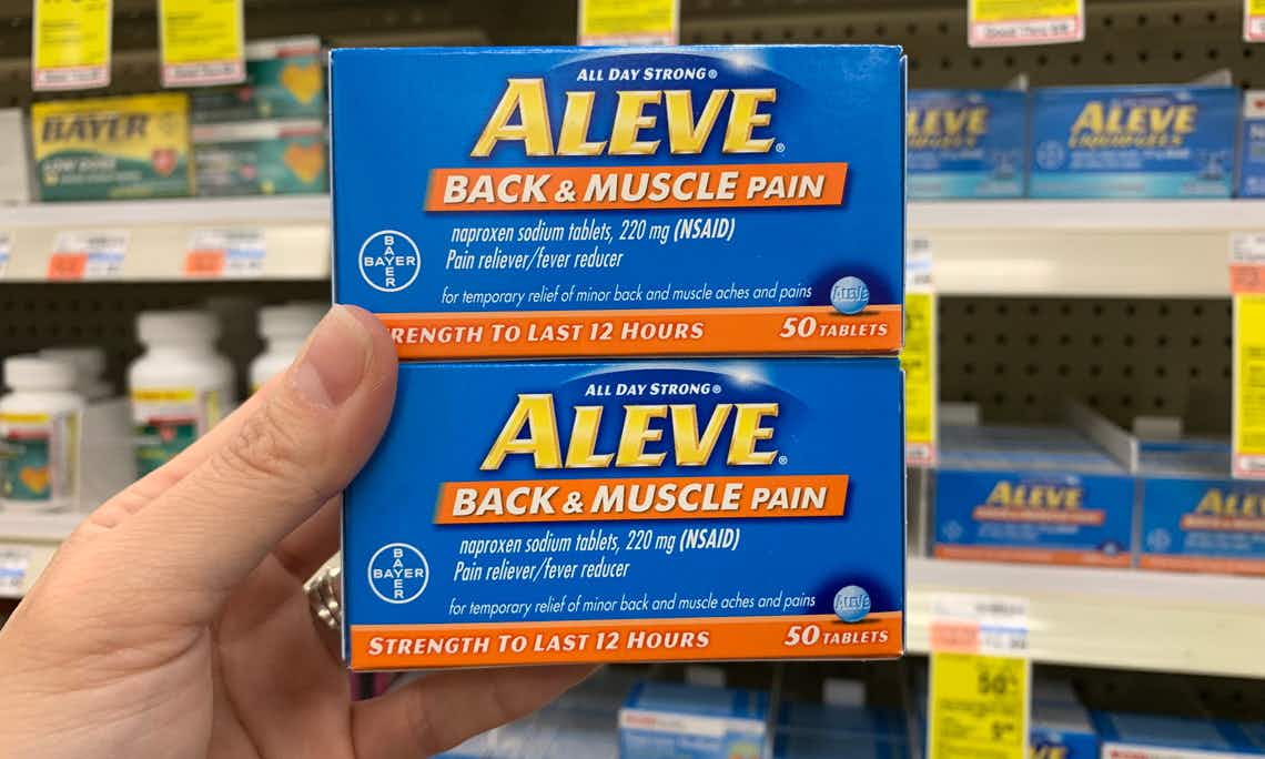 Two packages of Aleve back and muscle pain reliever in a store.