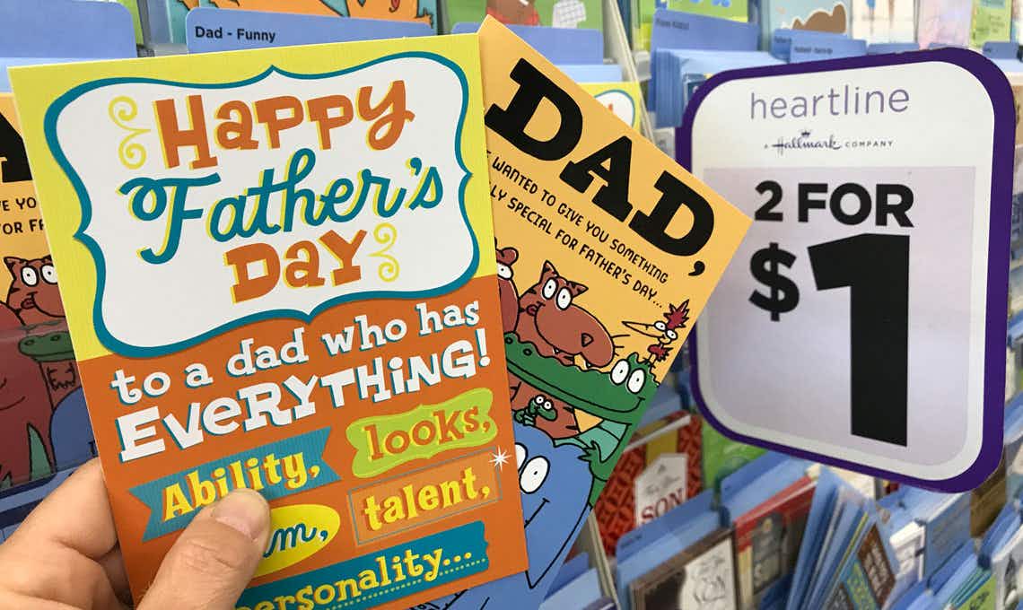 hand holding fathers day cards at dollar tree