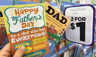 hand holding fathers day cards at dollar tree
