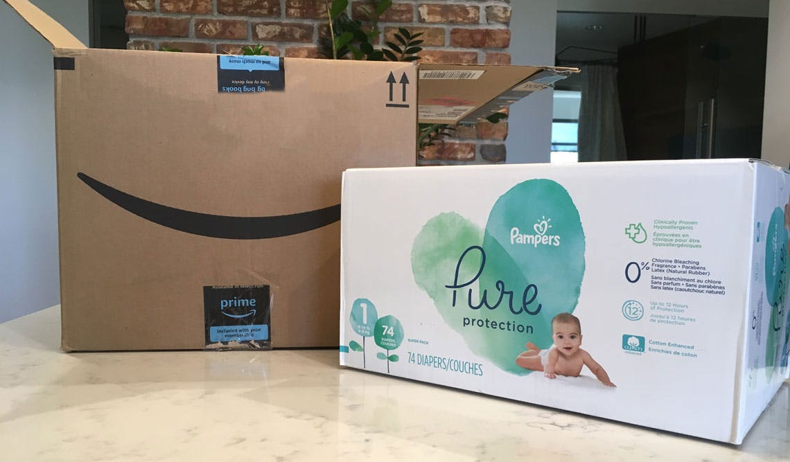 pampers pure disposable diapers next to amazon box