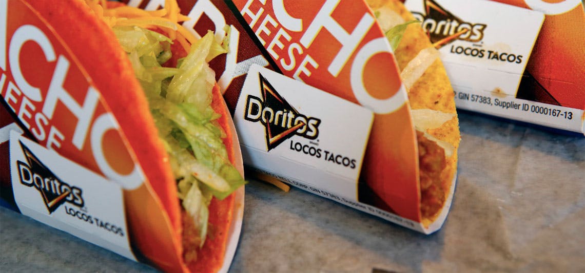 A close-up of three Doritos Locos Tacos from Taco Bell.