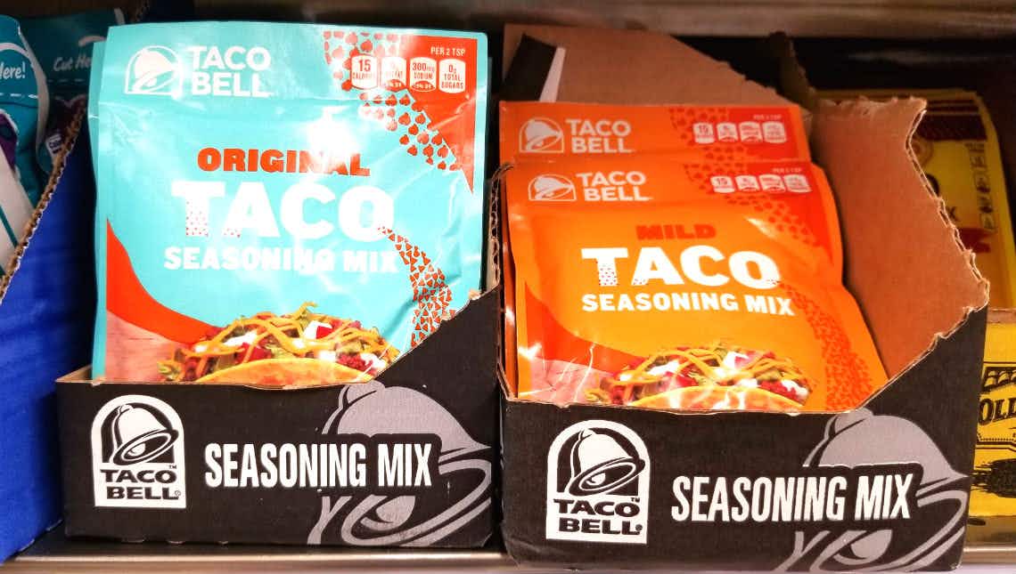 packages of taco bell seasoning mix on grocery store shelf