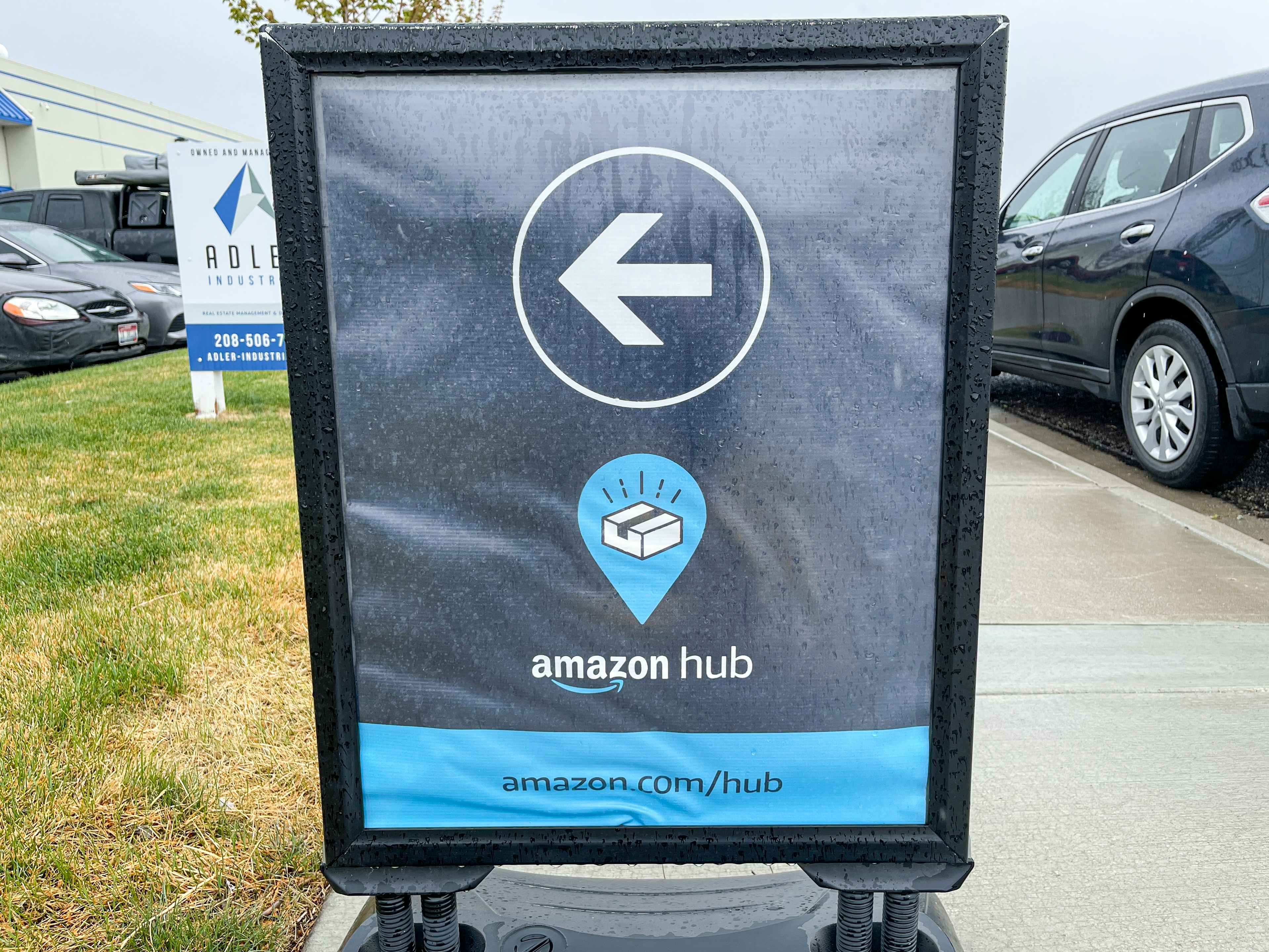 A sign pointing to an amazon hub location.
