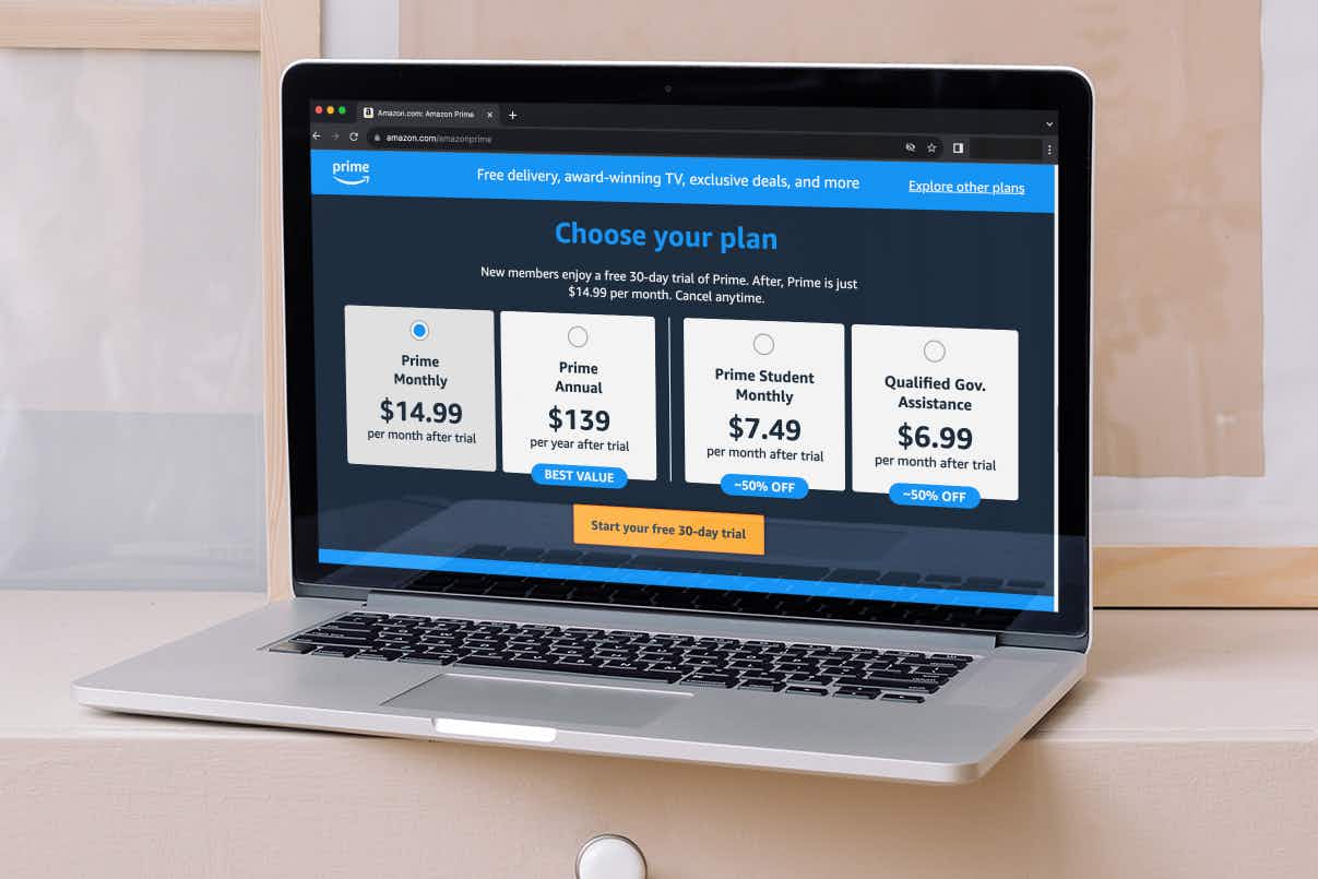 a laptop open to display the amazon prime webpage showing the prices for subscriptions