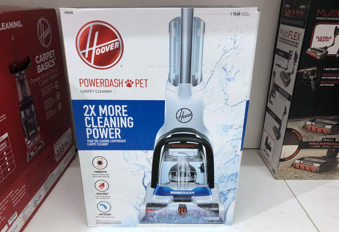 A Hoover Powerdash vacuum in its box sitting on a shelf at Kohl's.