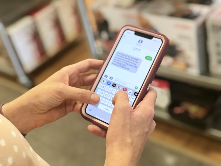 A person texting on a smartphone.