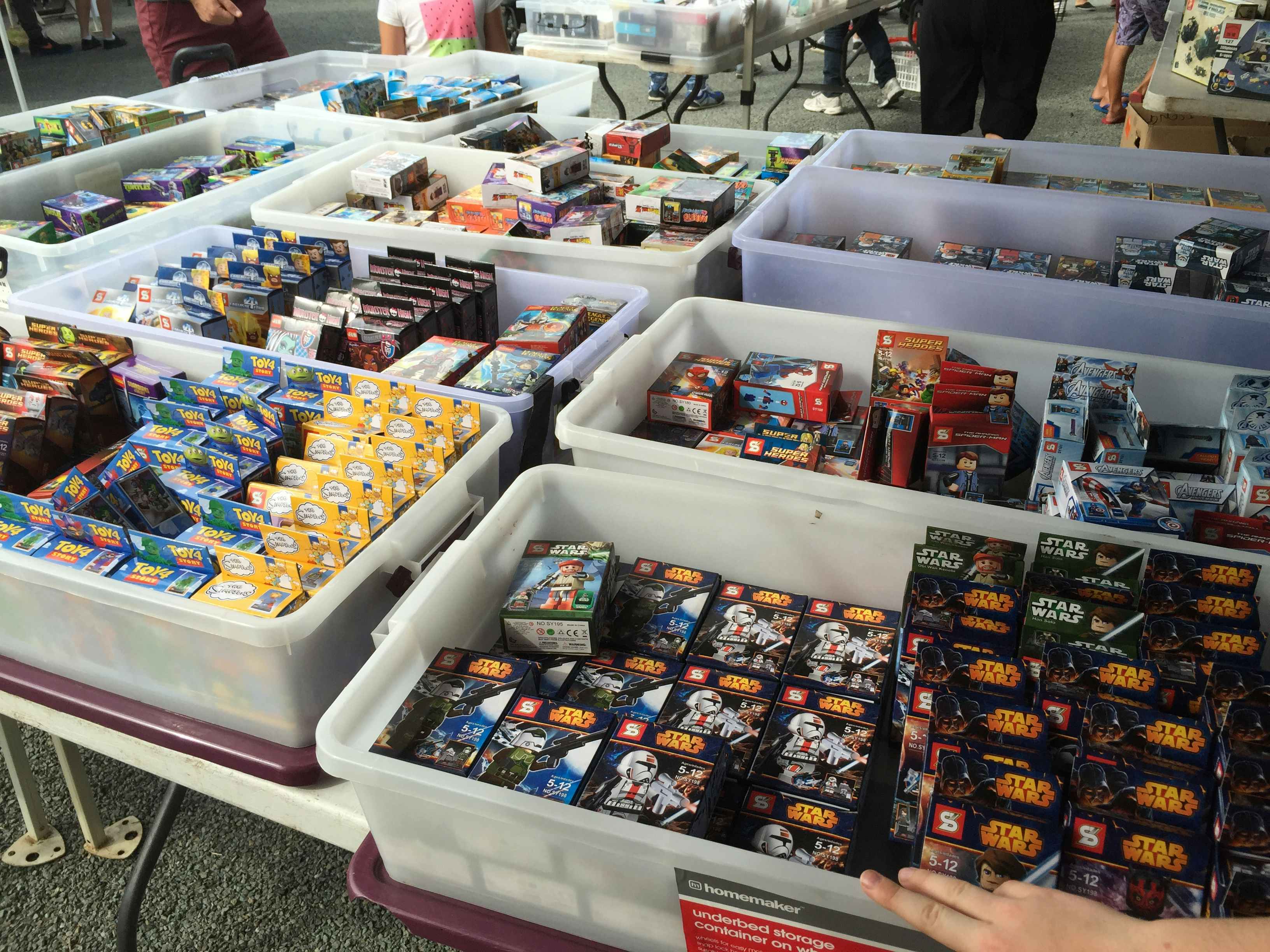 boxes of legos at a garage sale