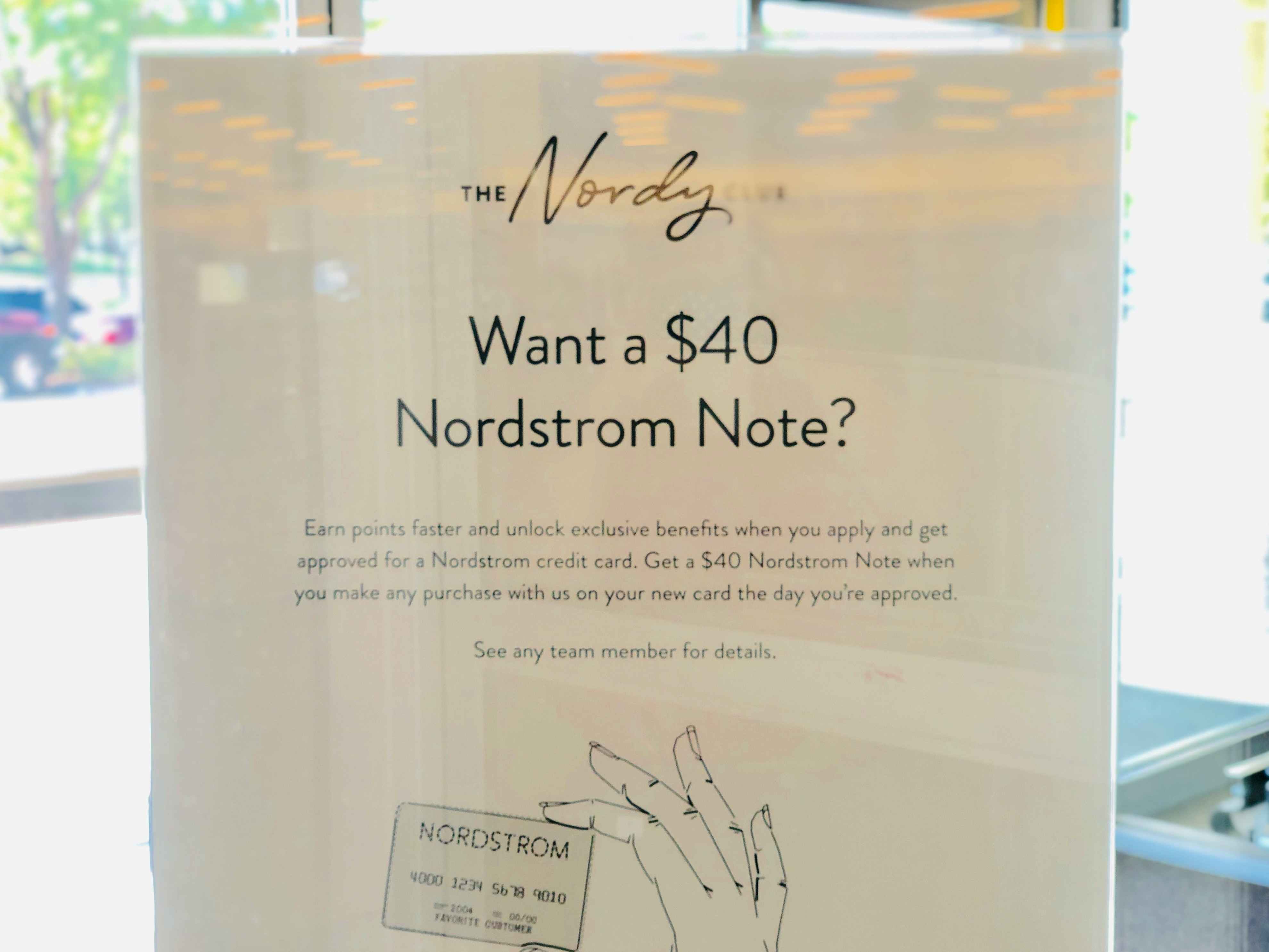 A sign for the promotional offer with the Nordstrom credit card.