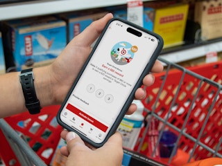 someone shopping in Target looking at the bonus offer on their Target circle app