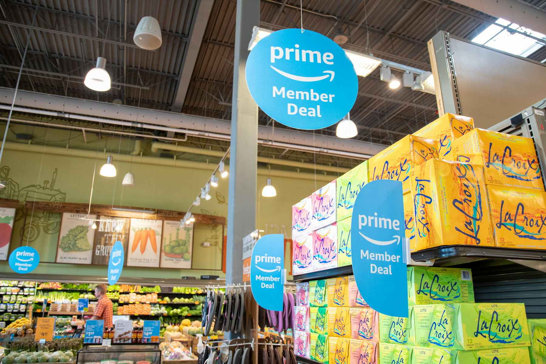 prime member deals signs hung up over items inside Whole Foods 
