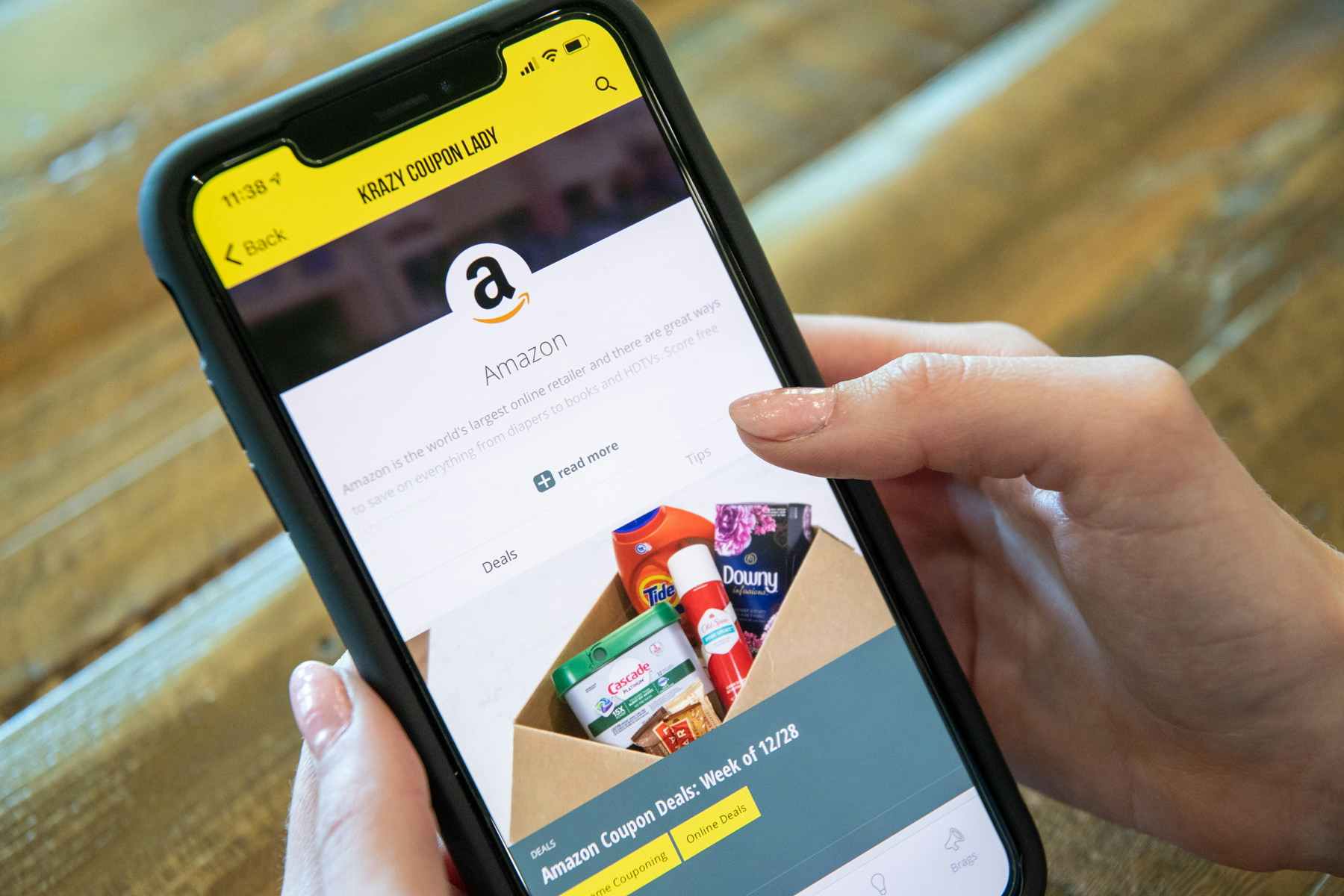 person holding phone and setting up amazon price notifications