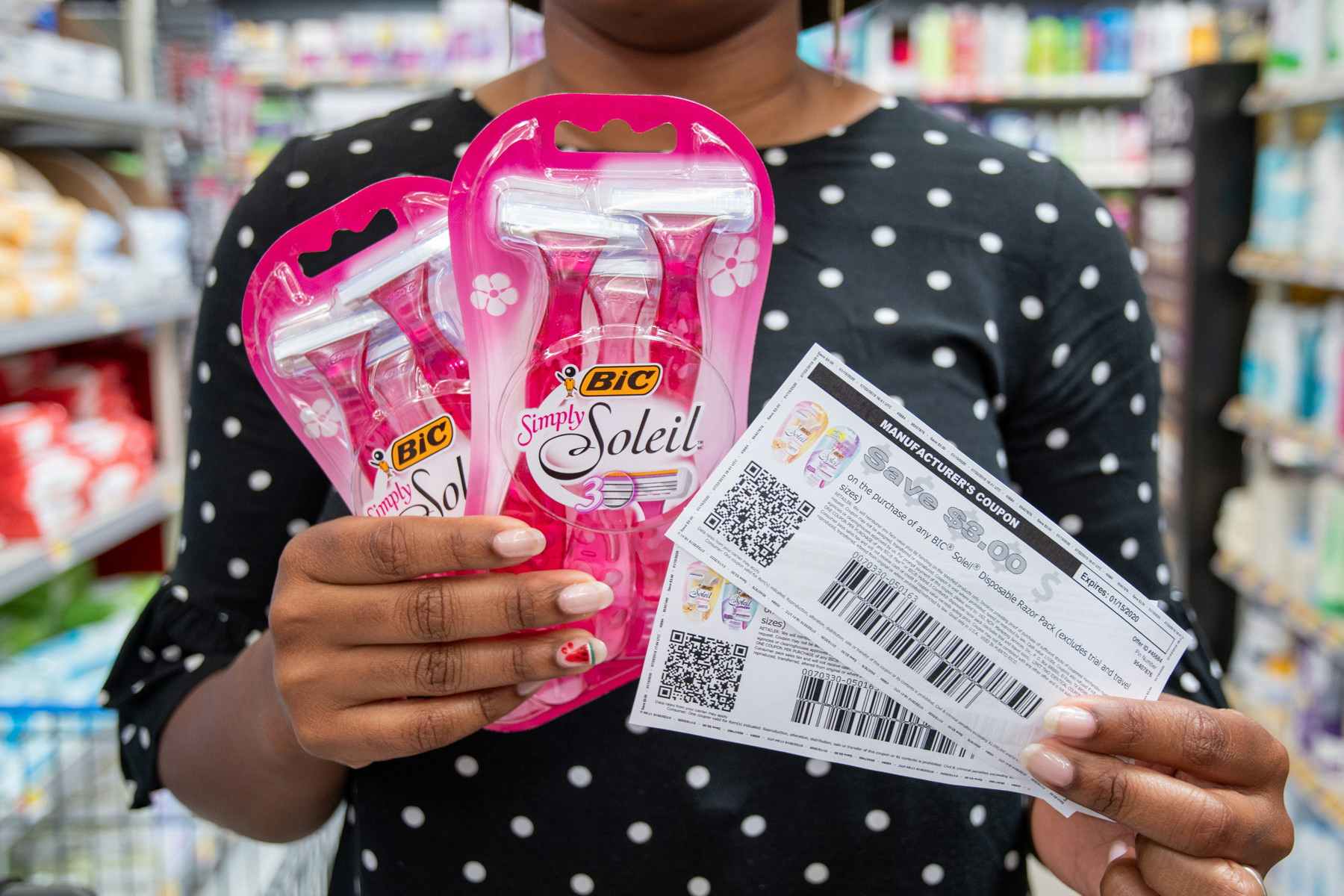 Women holding Bic Soleil razors and two coupons