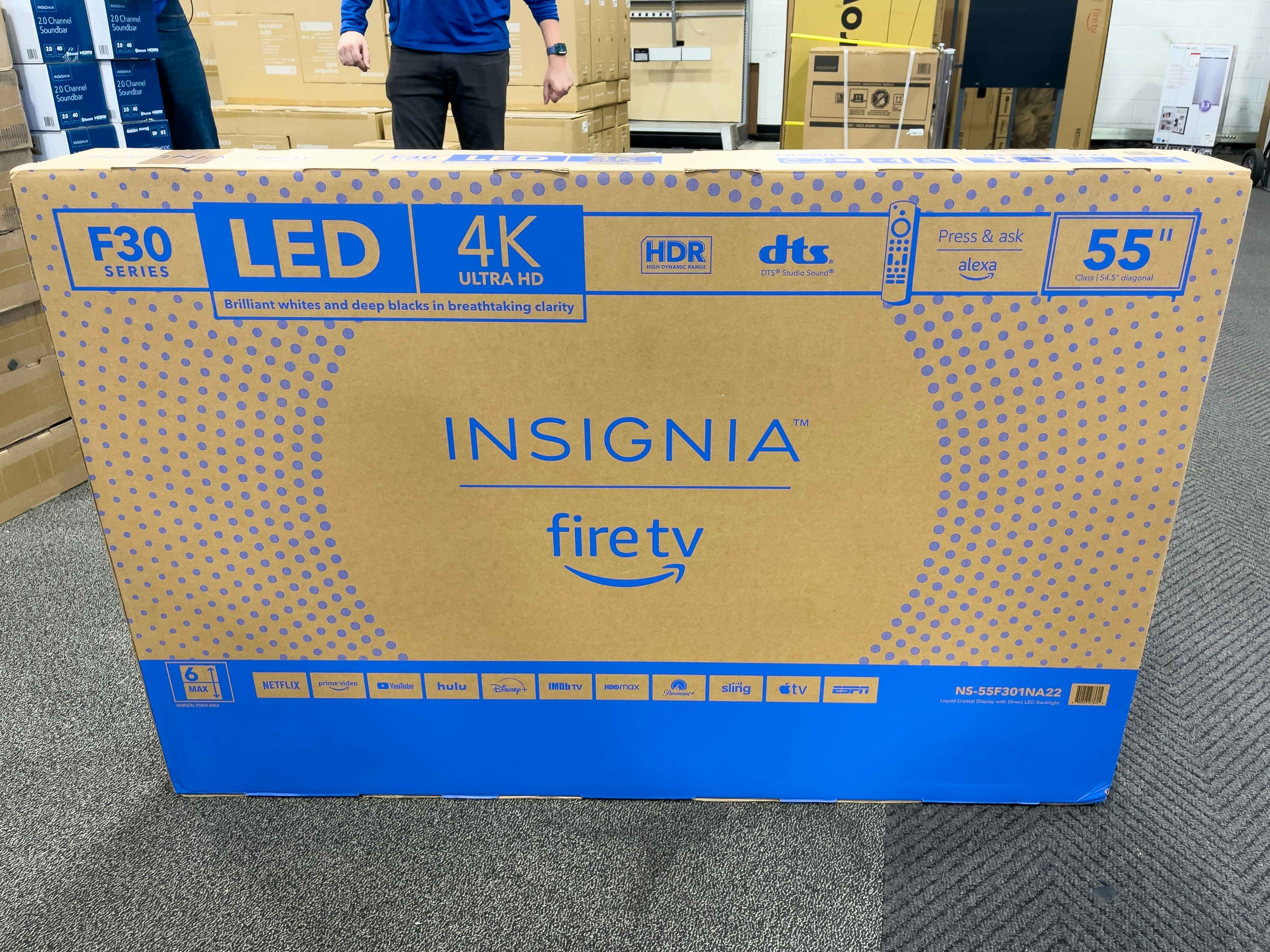 a 55-inch Insignia Fire TV box on the floor at Best Buy