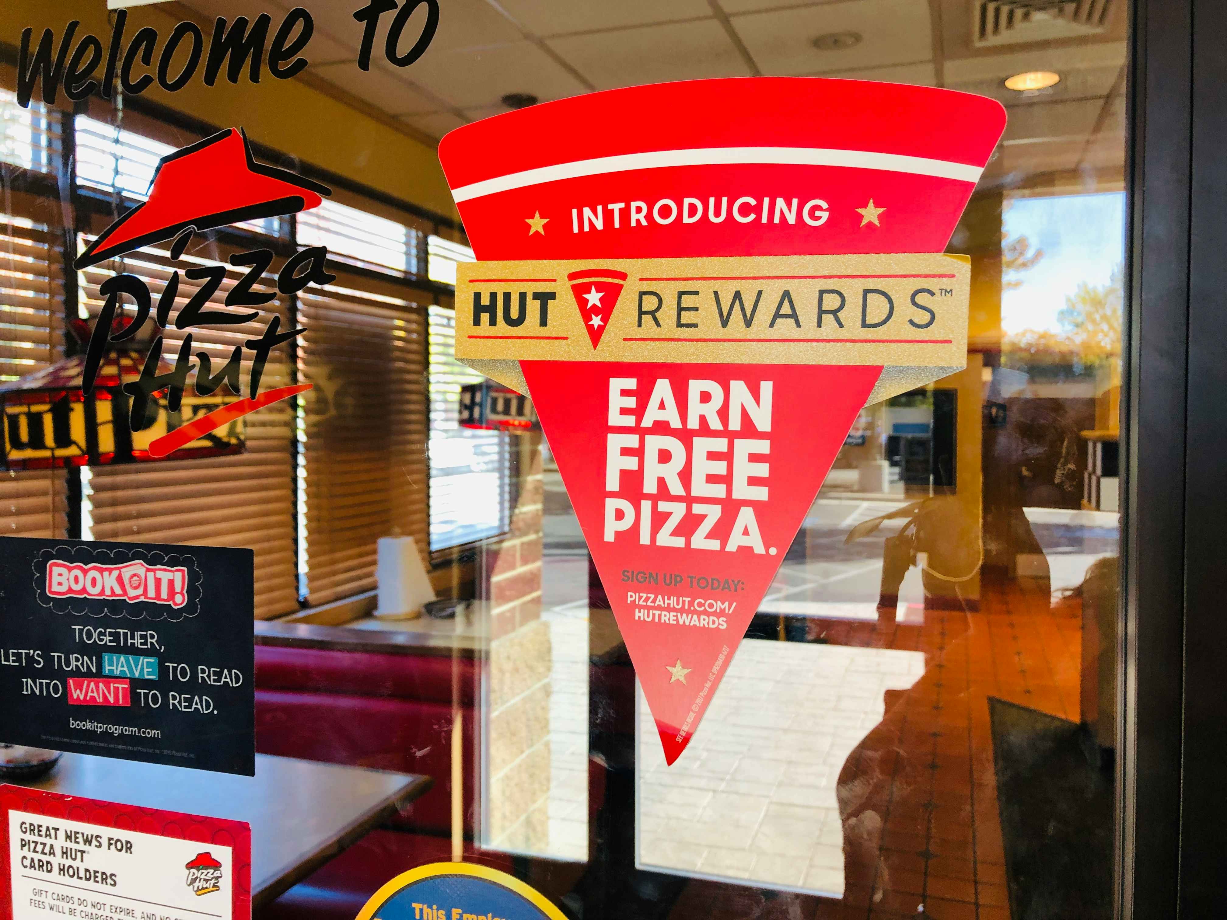 A sign for Pizza Hut's Hut Rewards 