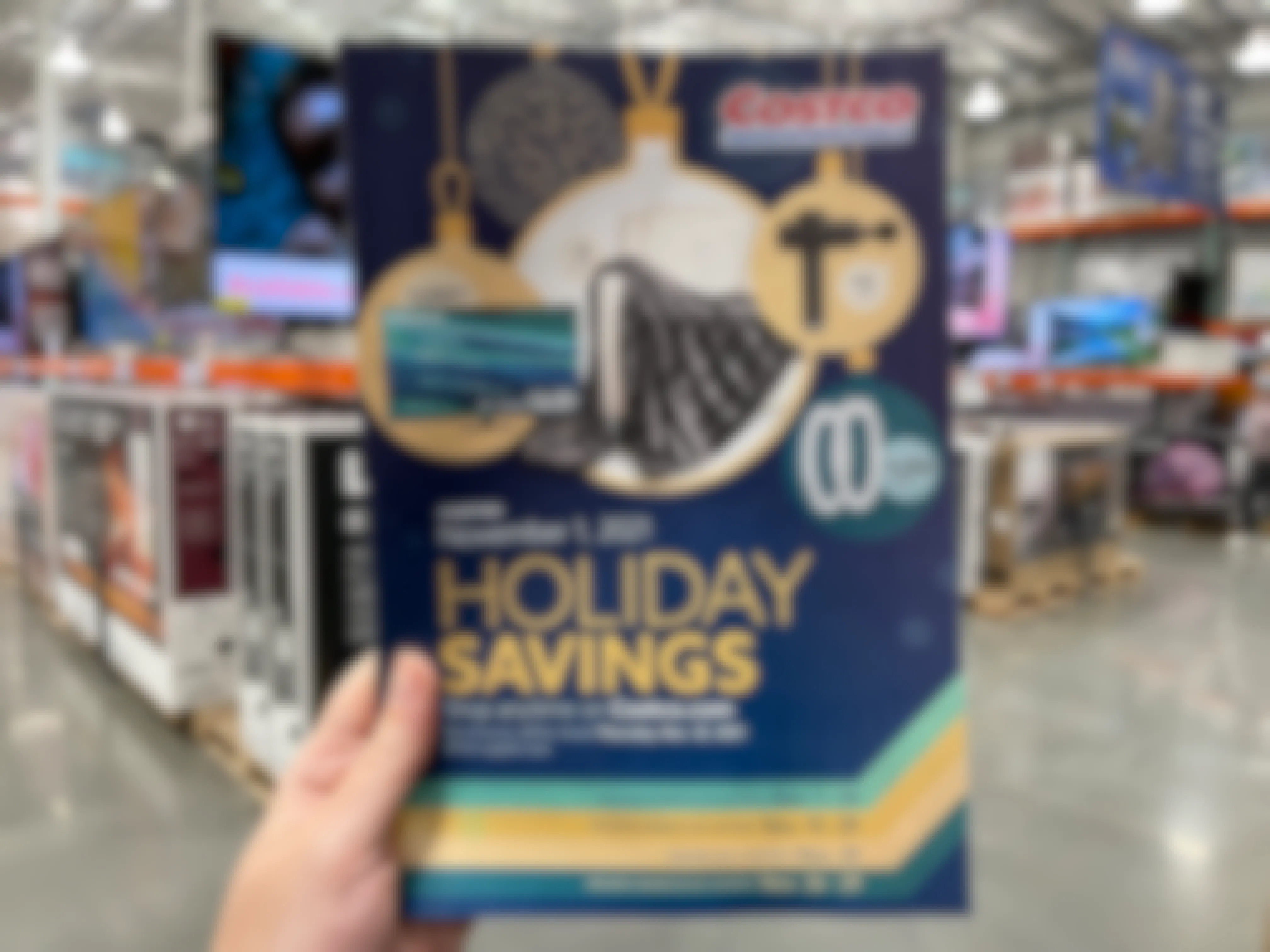 A 2021 holiday savings book for Costco held in the store.