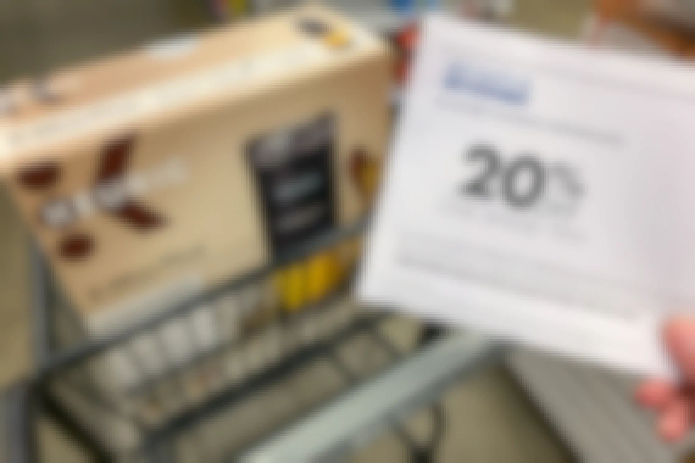 20% off Bed Bath and Beyond coupon held near a Keurig coffee maker in store