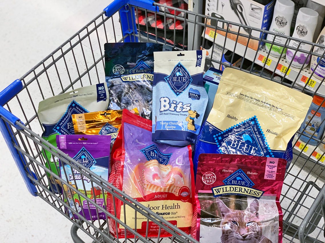 A shopping basket filled with Blue Buffalo dog treats and food