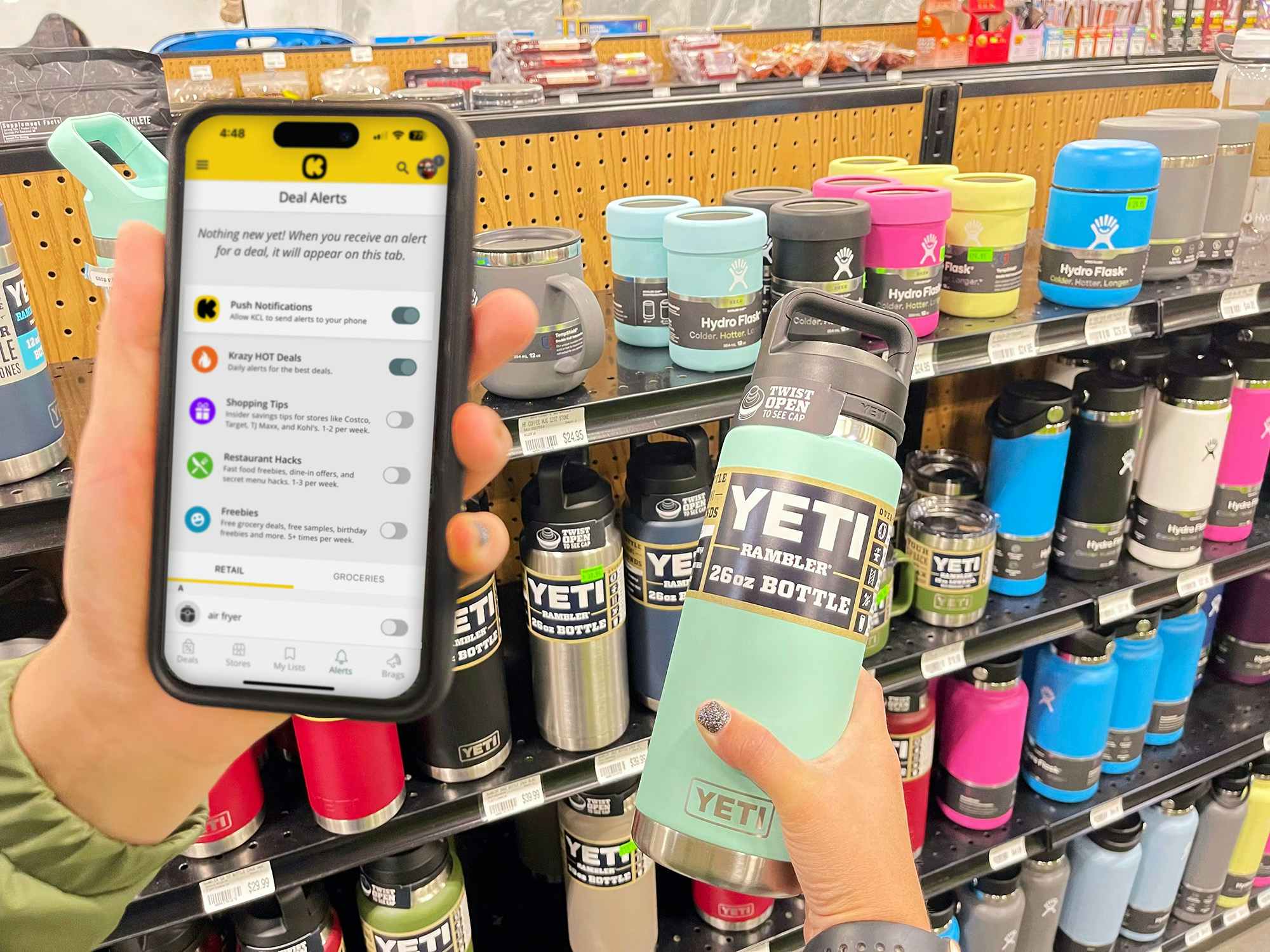 someone activating their deal alerts on the KCL app while holding a YETI bottle