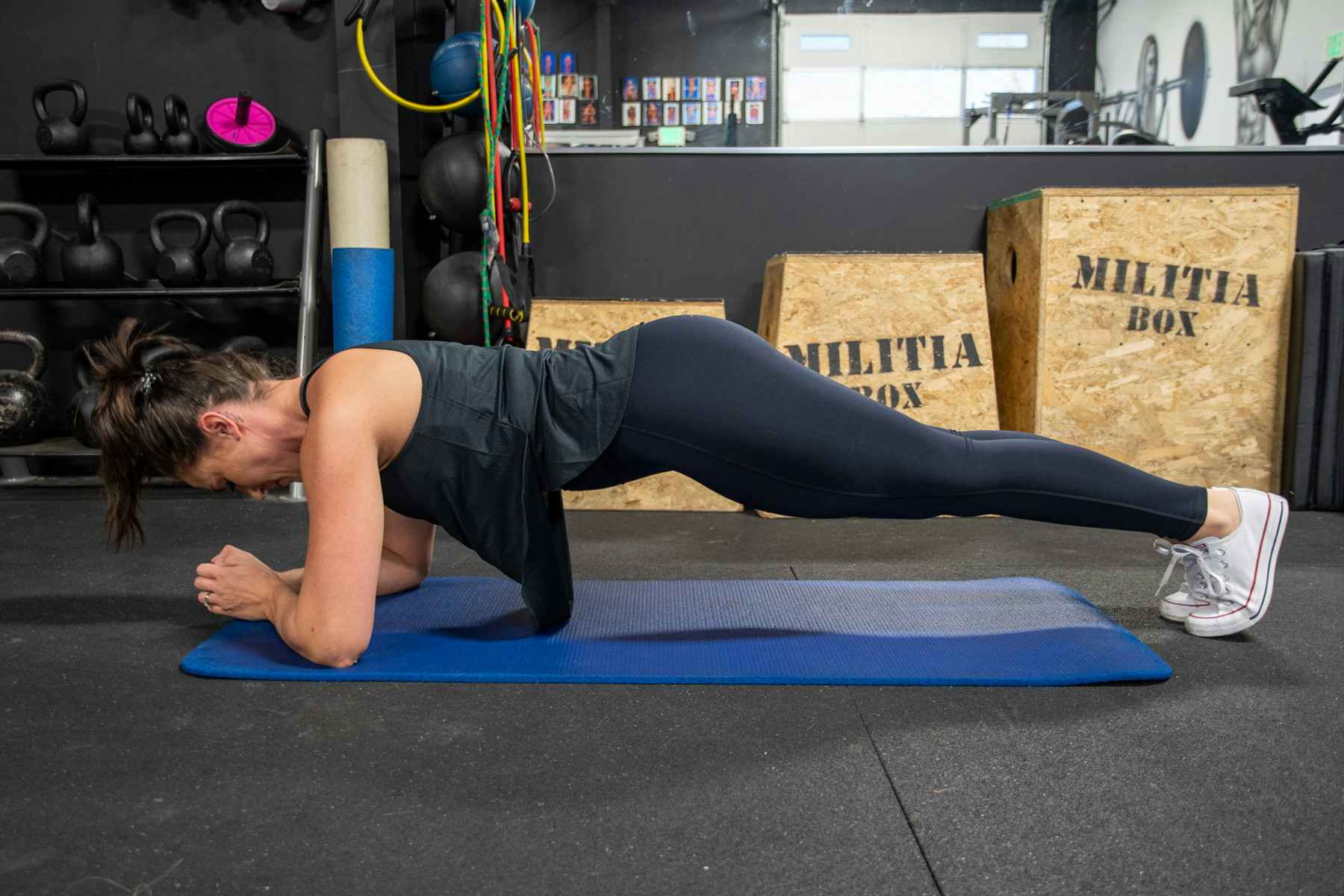 woman planking in fabletics workout wear