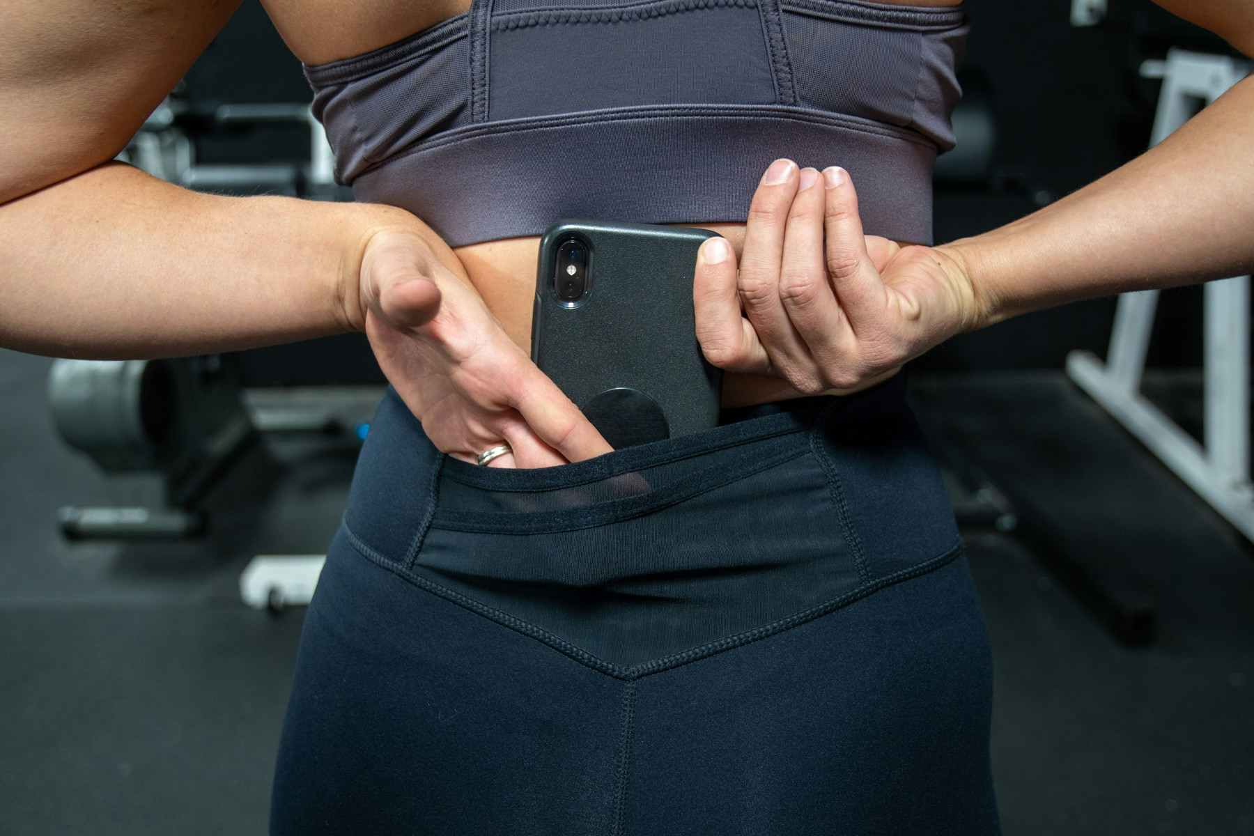 woman wearing Fabletics Trinity Leggings with a cell phone in back pocket