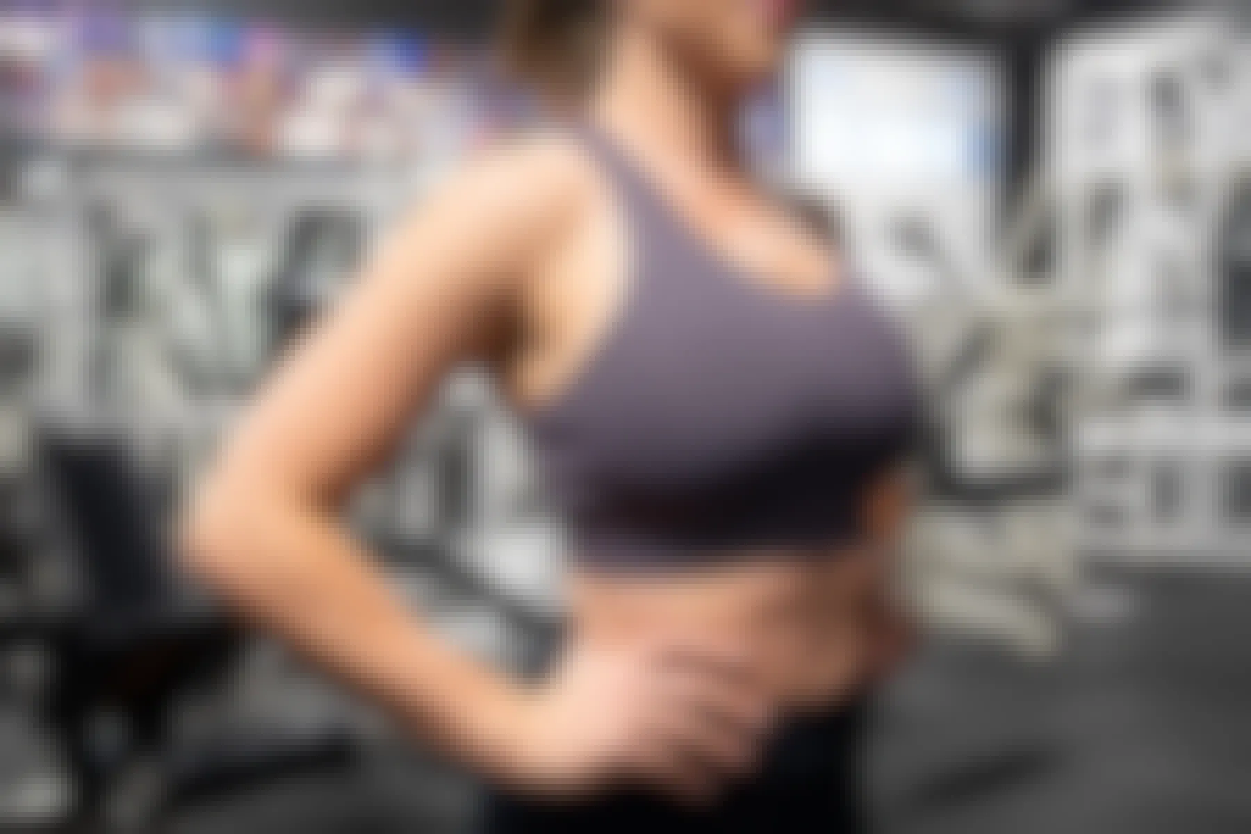 woman wearing fabletics mila sports bra at gym