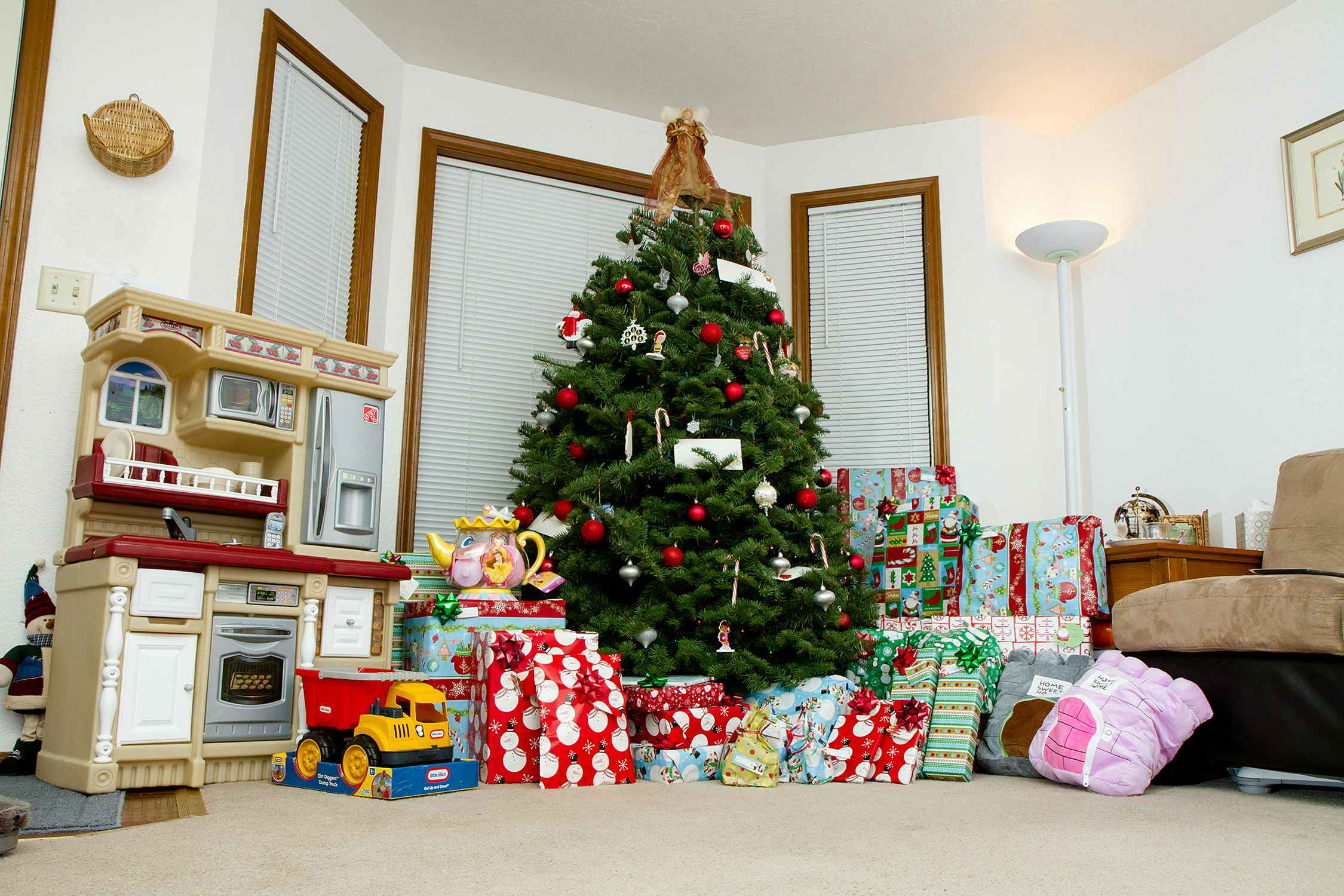 Presents Lined up against the tree ready for christmas