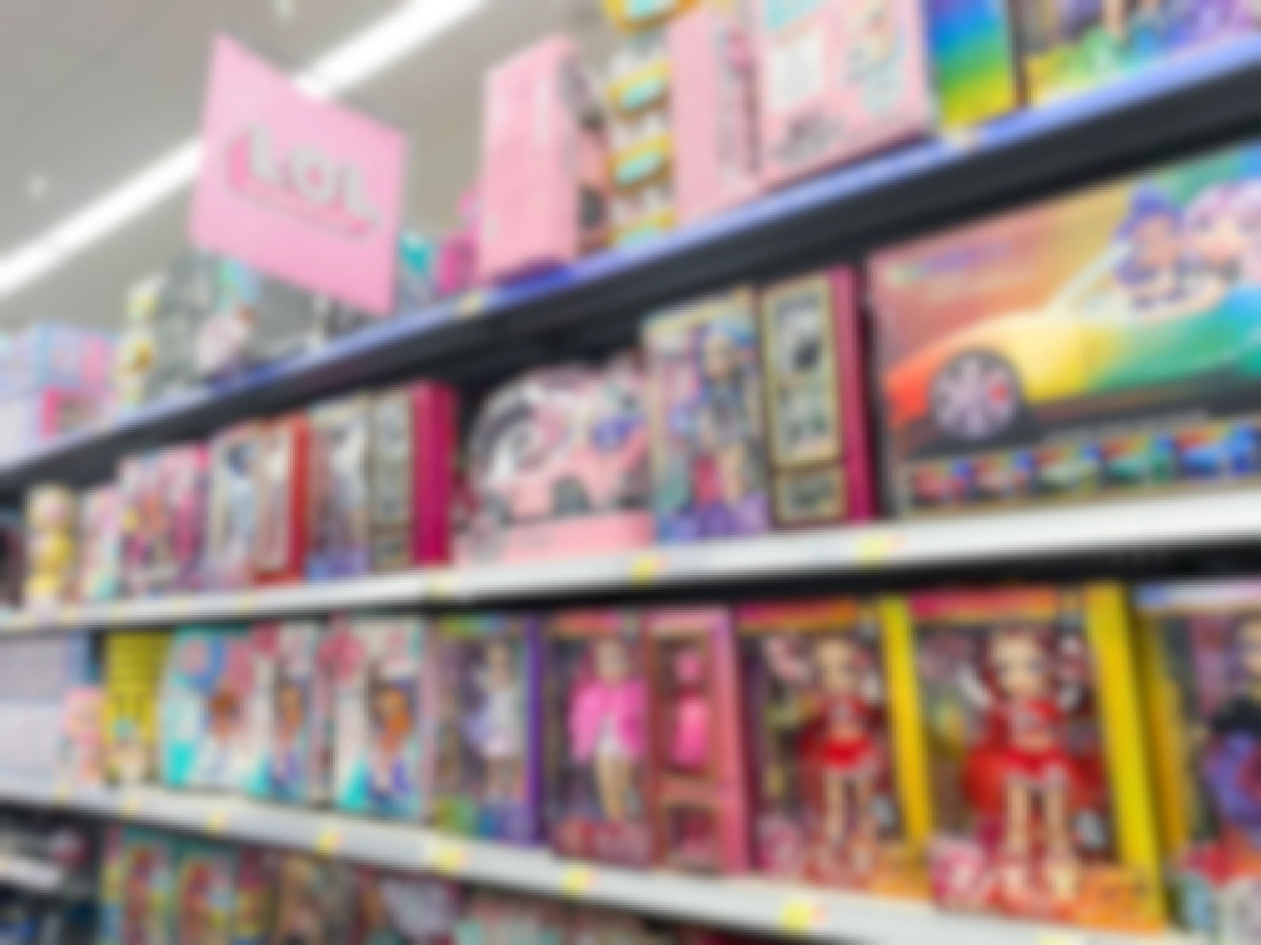 rainbow high dolls and LOL Surprise items on the shelf at Walmart