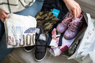 Woman hand showing Fabkids products