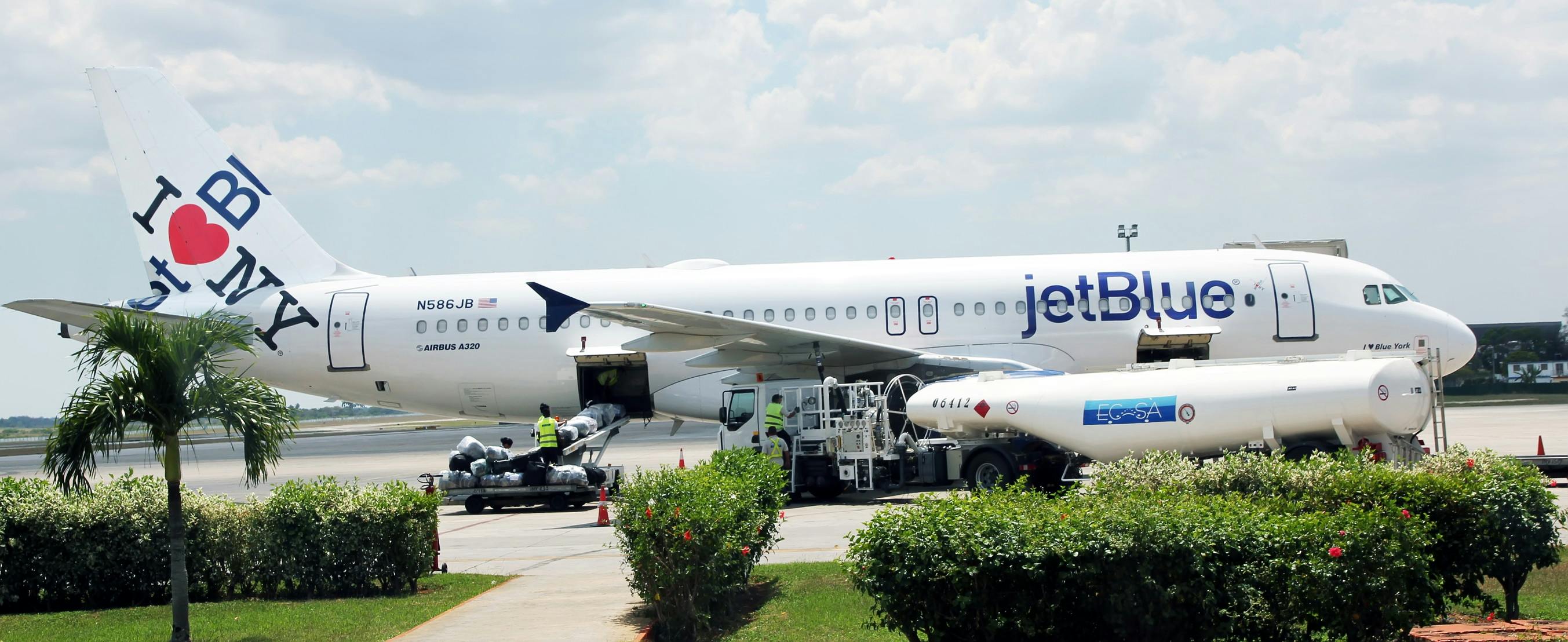 Jet Blue Jet on tarmac with I heart NYC written on the tail