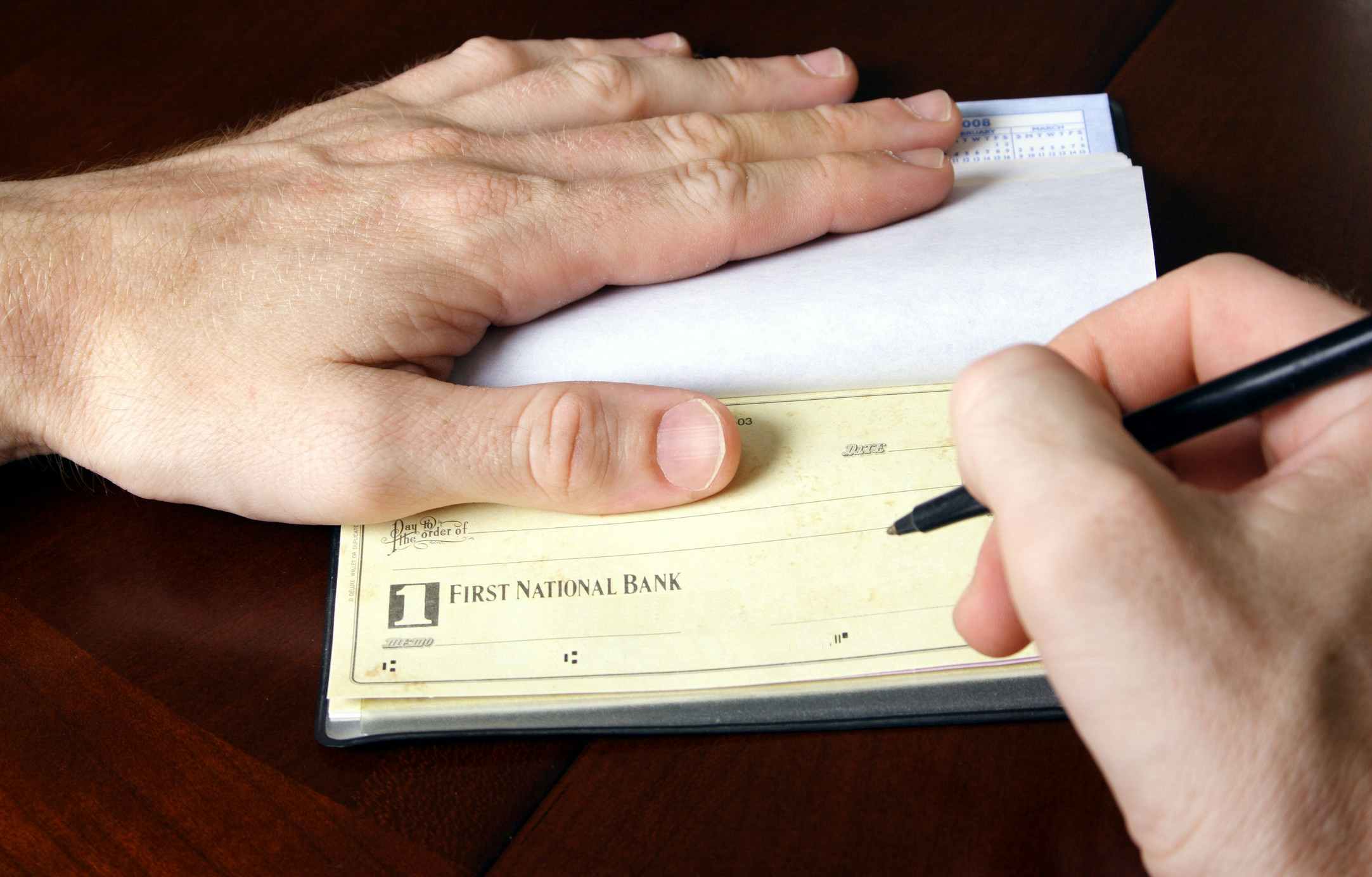 hand writing a check