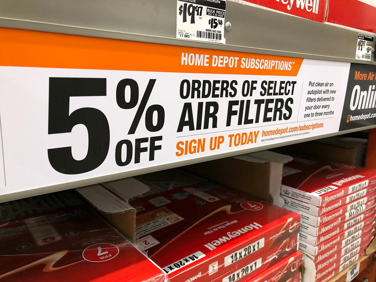 Air filters on the shelf at home depot with a notice that these are available for subscriptions at 5% off.