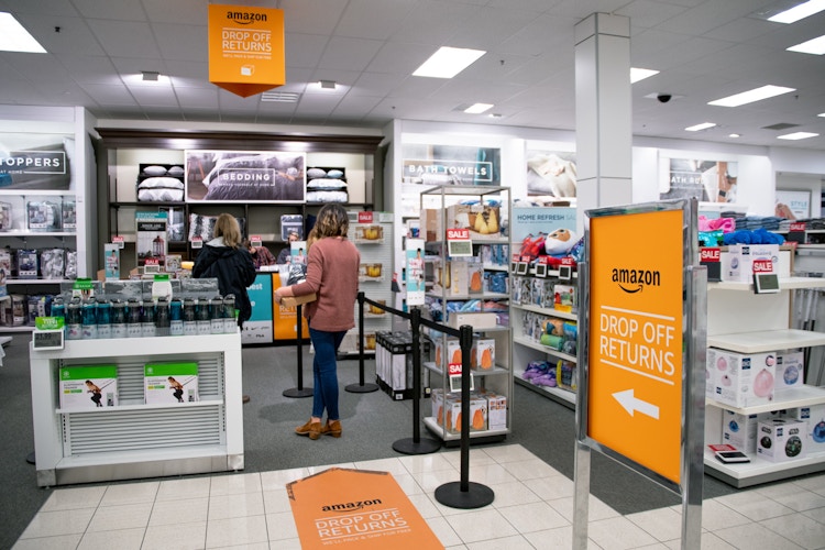 A woman standing in line to make anAmazon return at Kohl's.