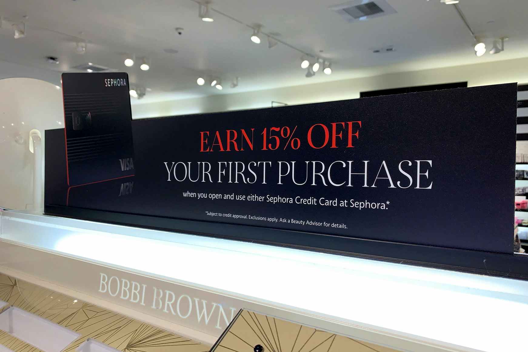 Sign for Sephora credit card in store.