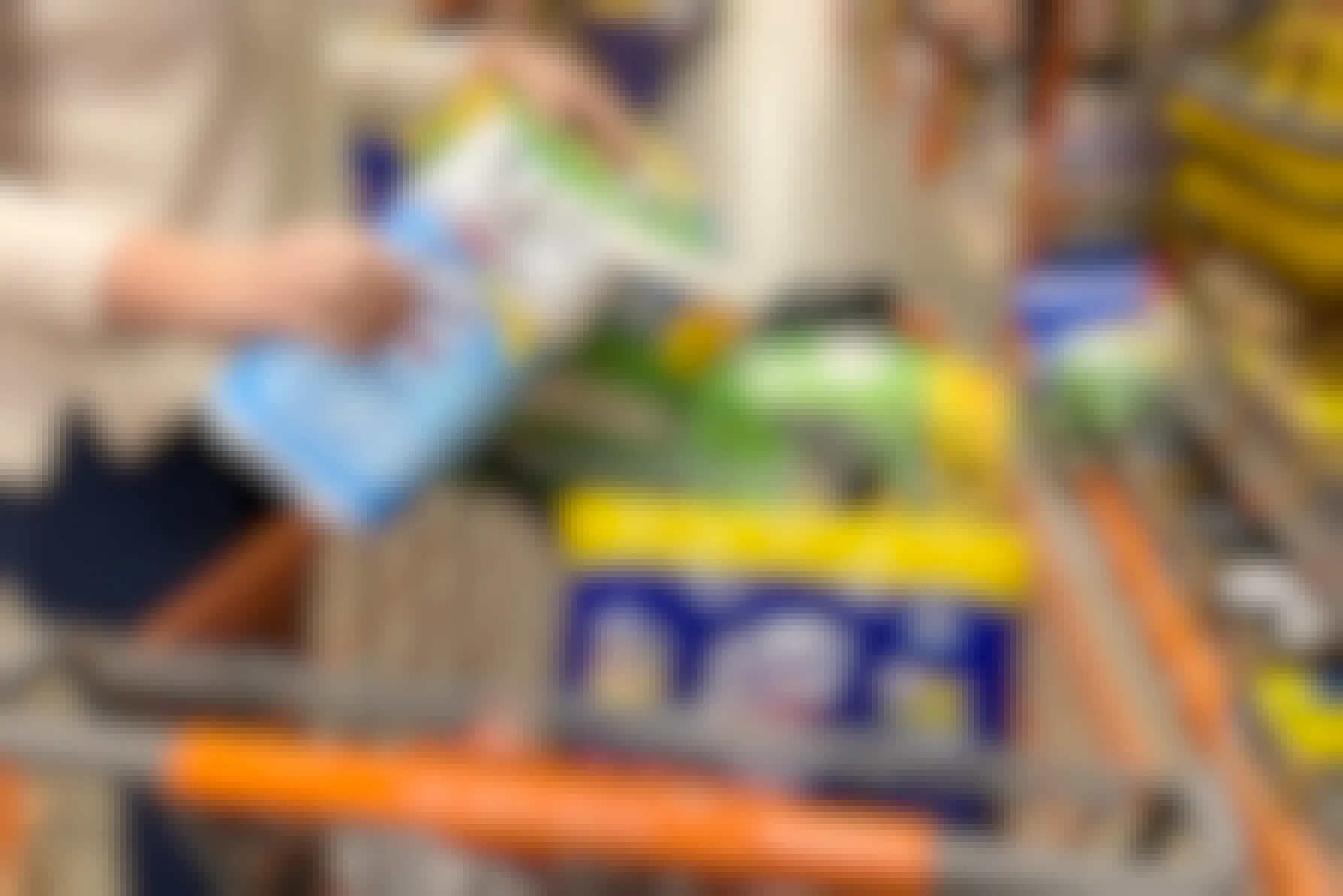 A Home Depot cart filled with cleaning supplies.
