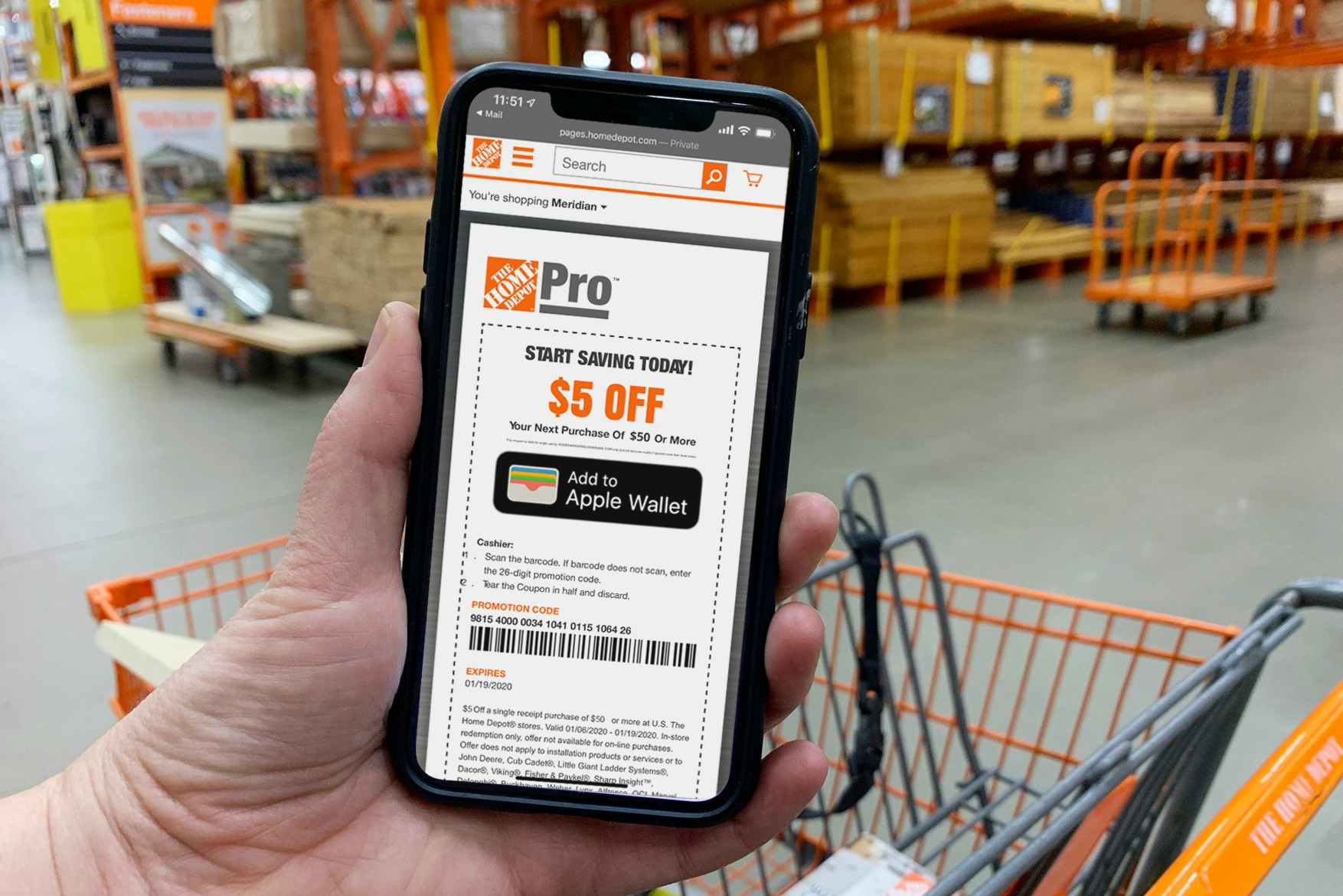 A hand holding a cell phone with a Home Depot $5 off $50 coupon on the screen.