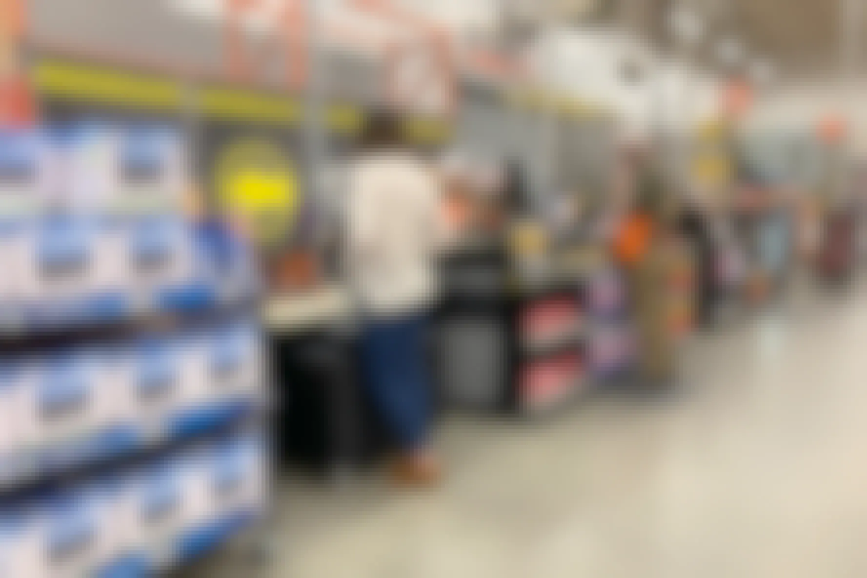 Woman talking to an employee at the Pro Service desk in the home depot.