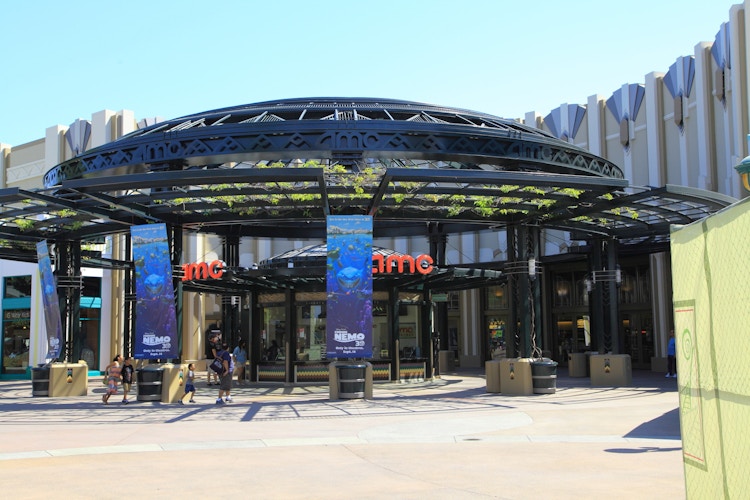 Outside view of AMC theater entrance with customers walking in