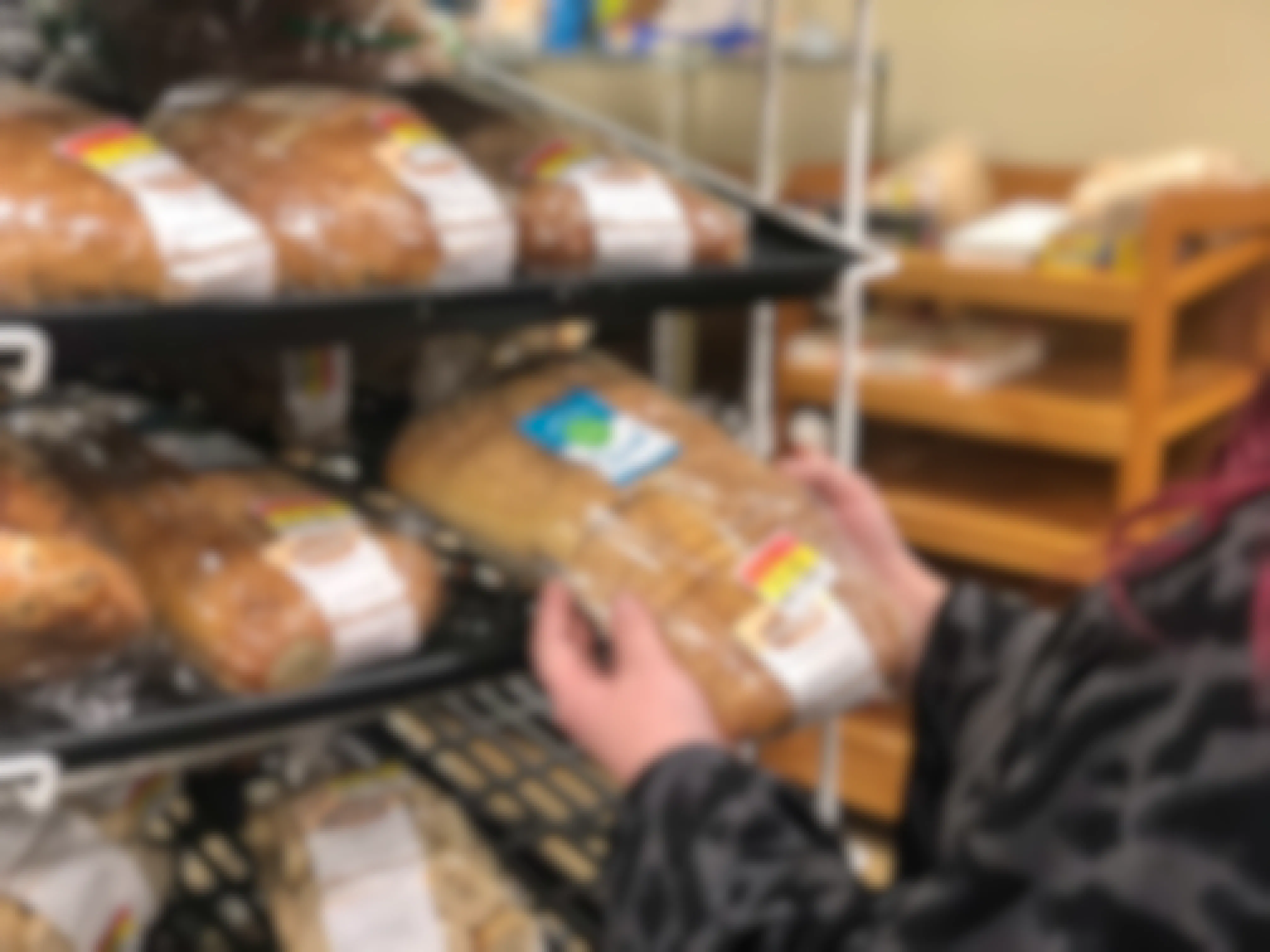 A woman shops for bread in the clearance section.