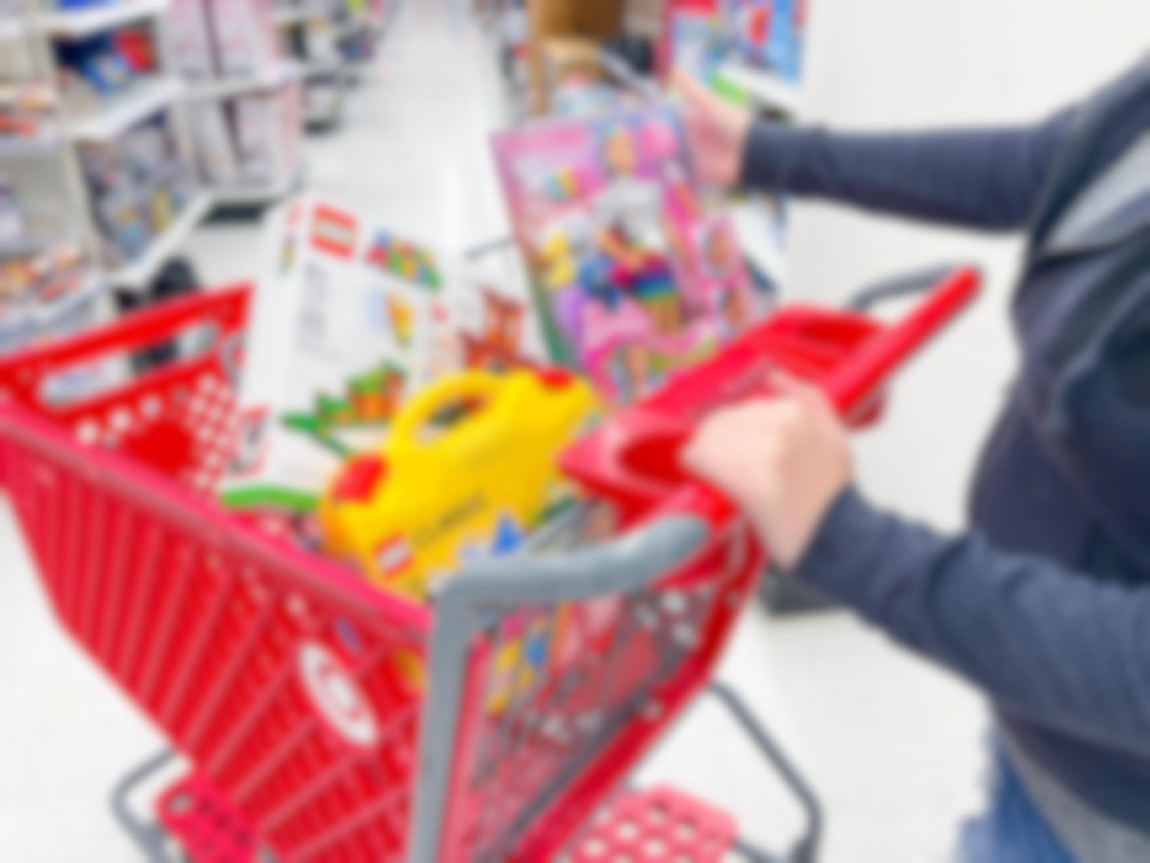 woman looking at toys in target cart