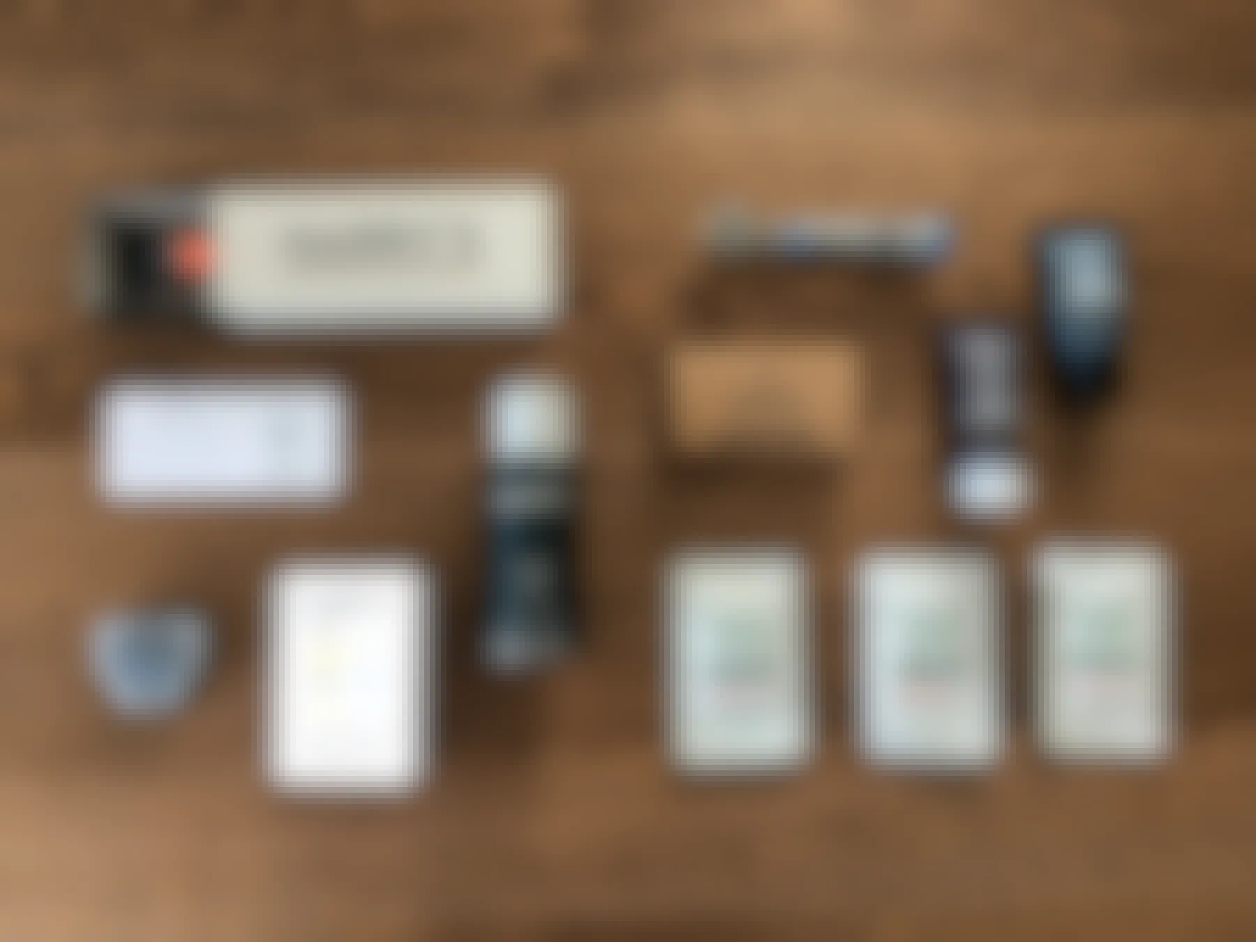 All the products that come in a Harry's and Dollar Shave Club boxes laid out on a table. 