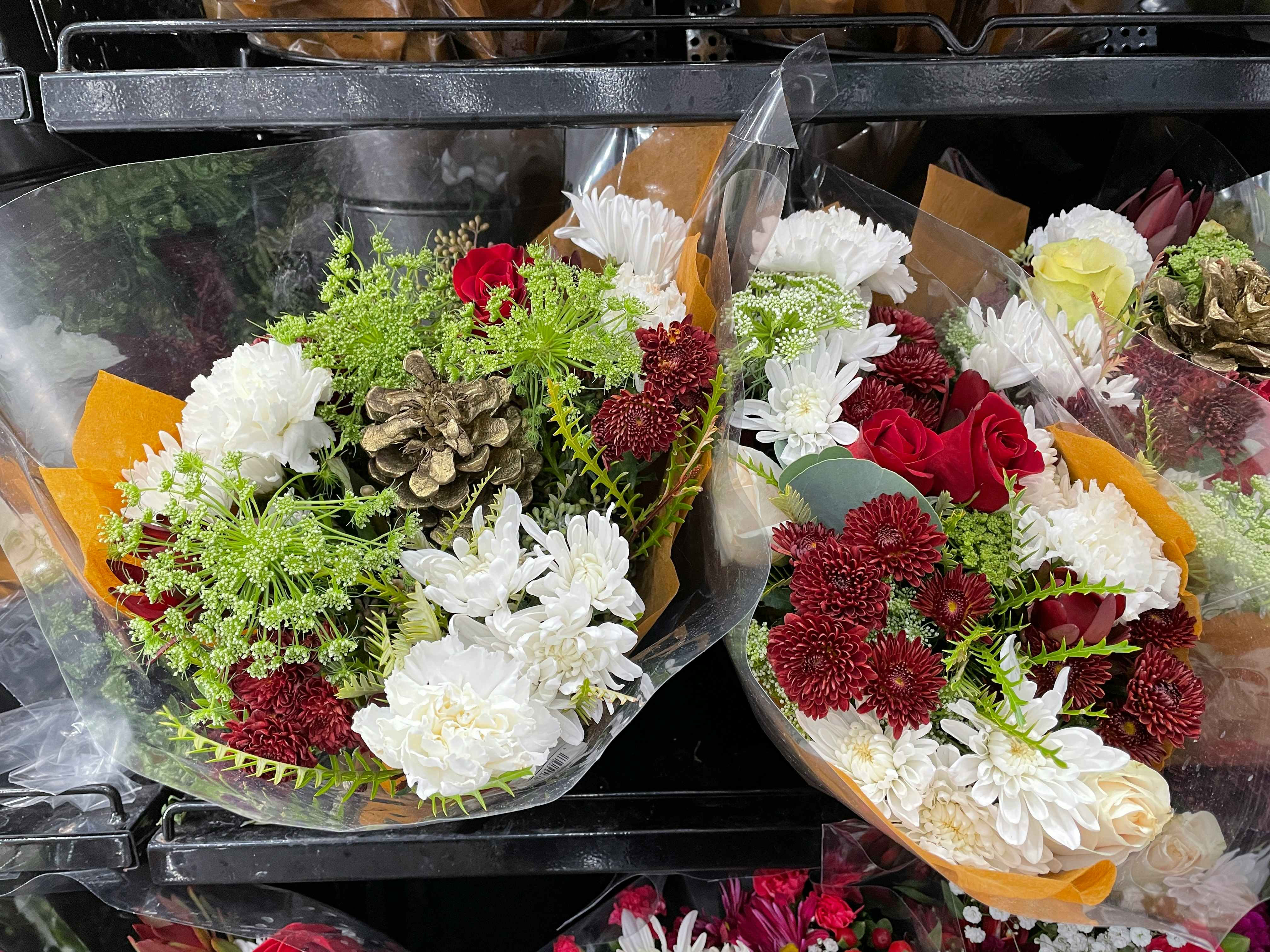A close up on some bouquets of flowers on a shelf in Costco
