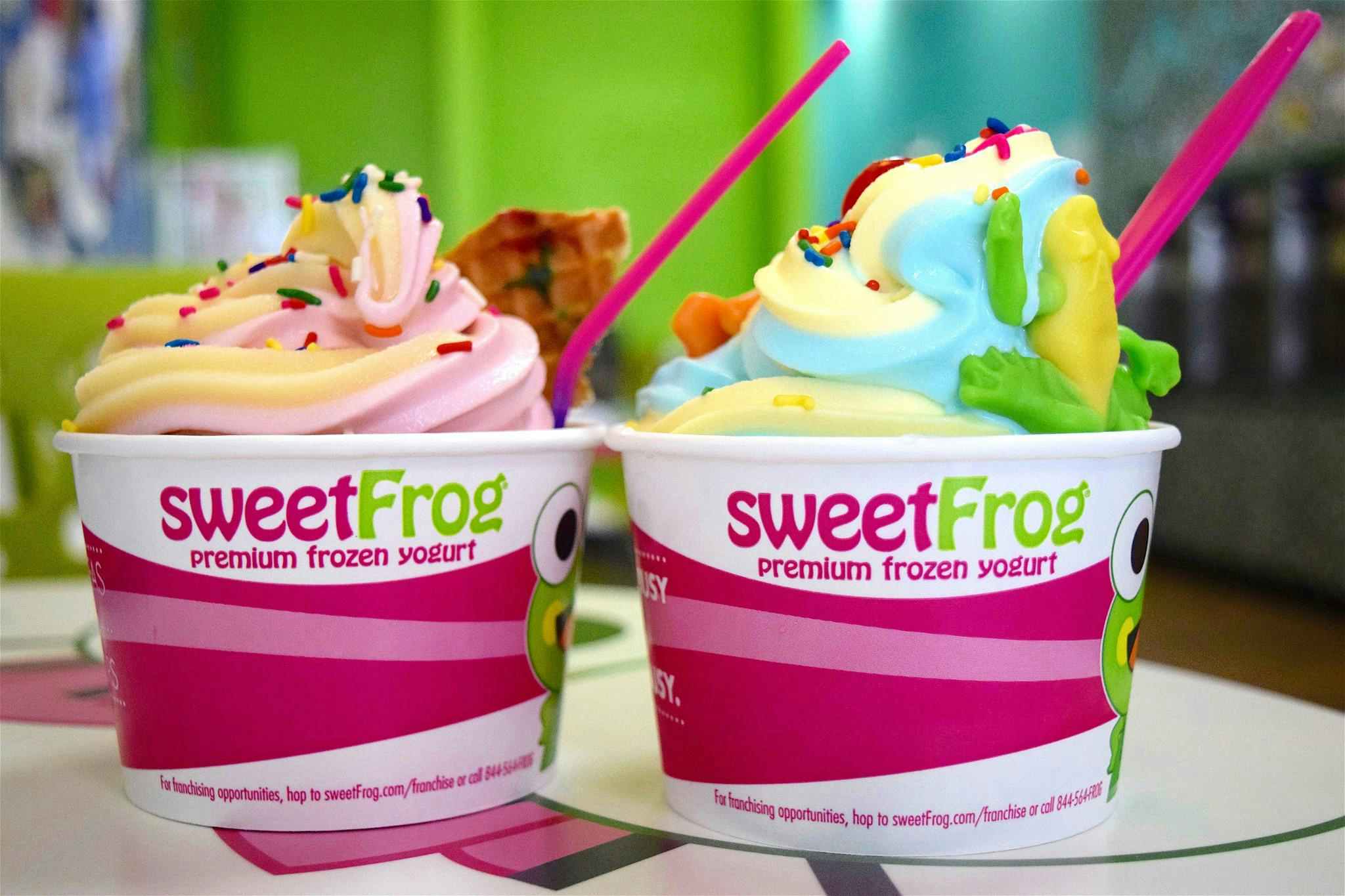 Two cups of SweetFrog froyo, which only cost as much as one cup on National Frozen Yogurt Day.