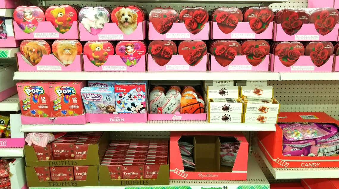 shelf at dollar store with heart shaped valentines boxes of chocolate