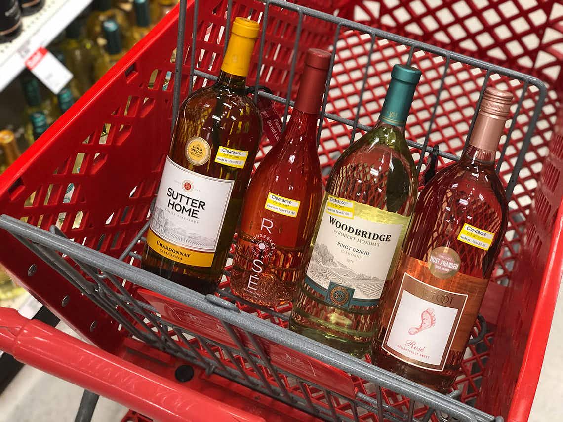 Four bottles of Target clearance wine in a shopping cart.