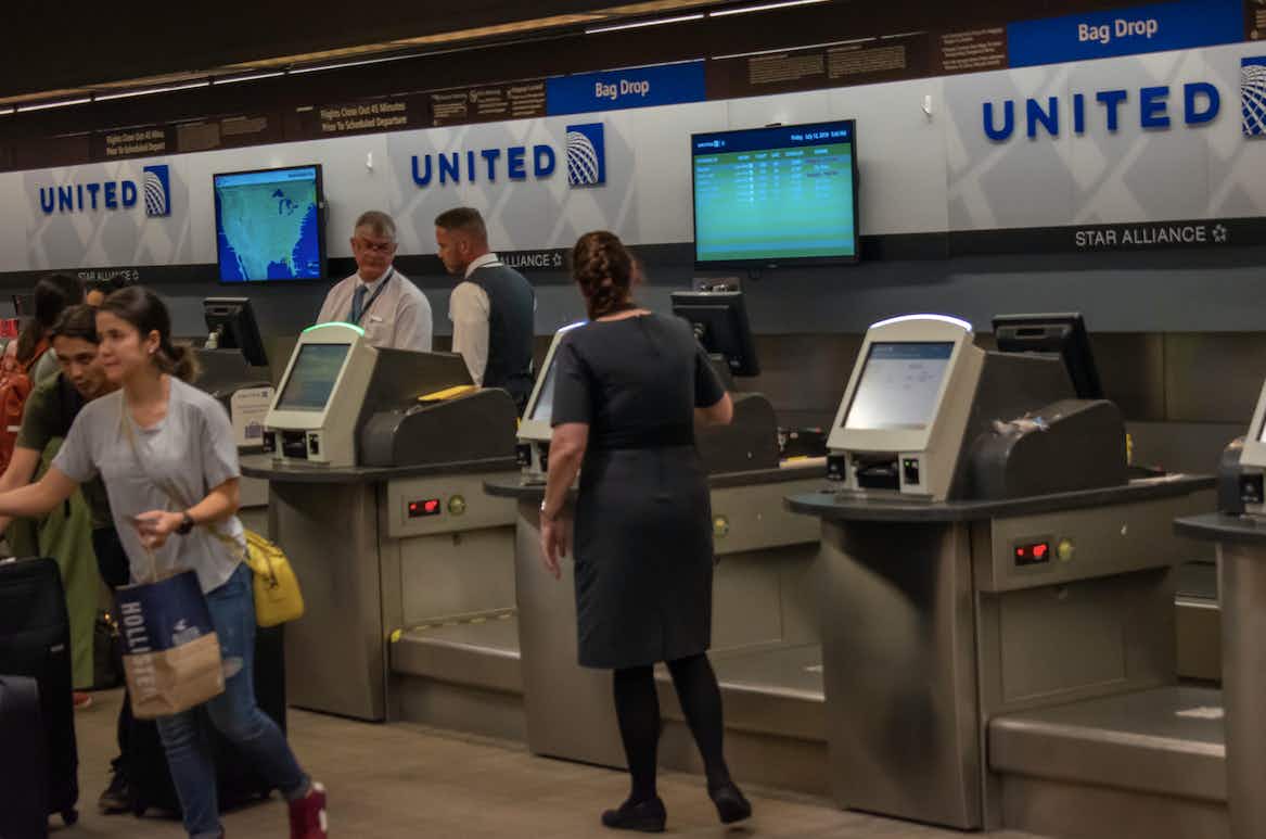 people standing by united desk